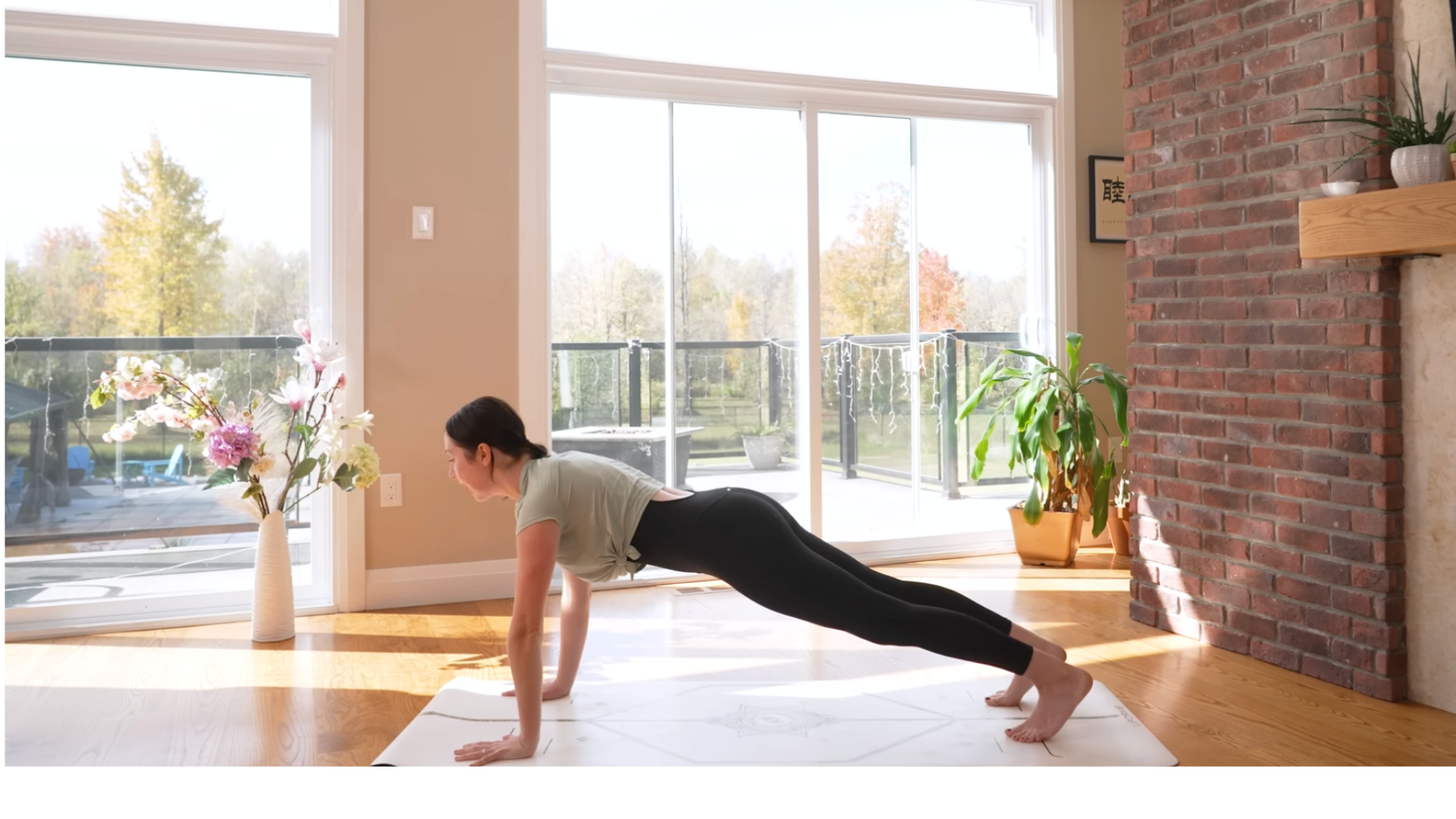 Woman on a yoga mat in Plank Pose for core-strengthening