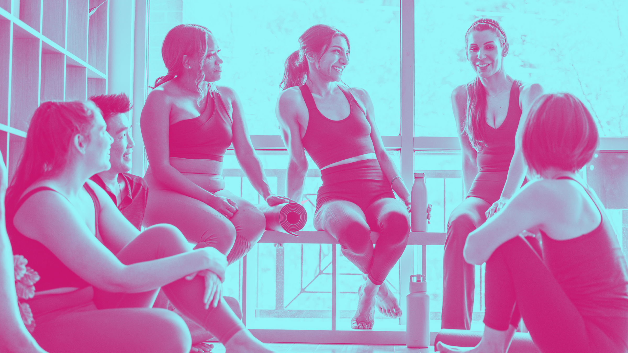 A group of women gathered in a 200 hour yoga teacher training