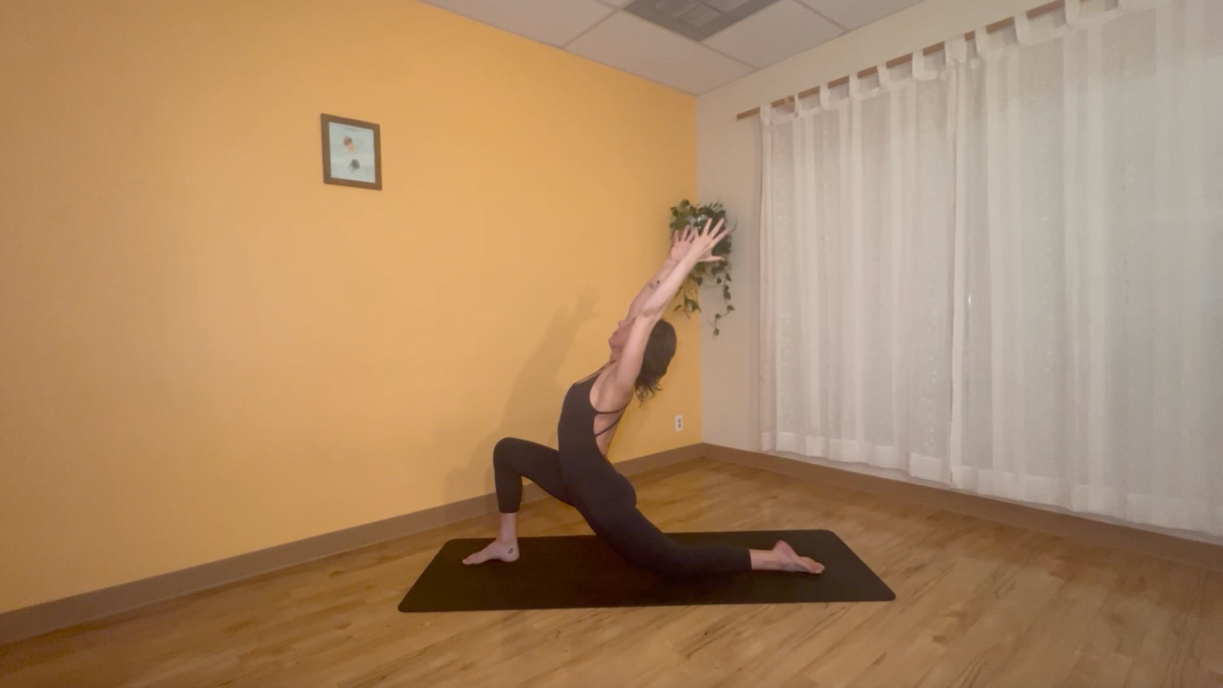 yoga teacher practicing low lunge