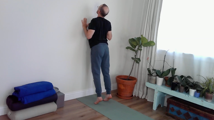 A yoga teacher in Cobra Pose