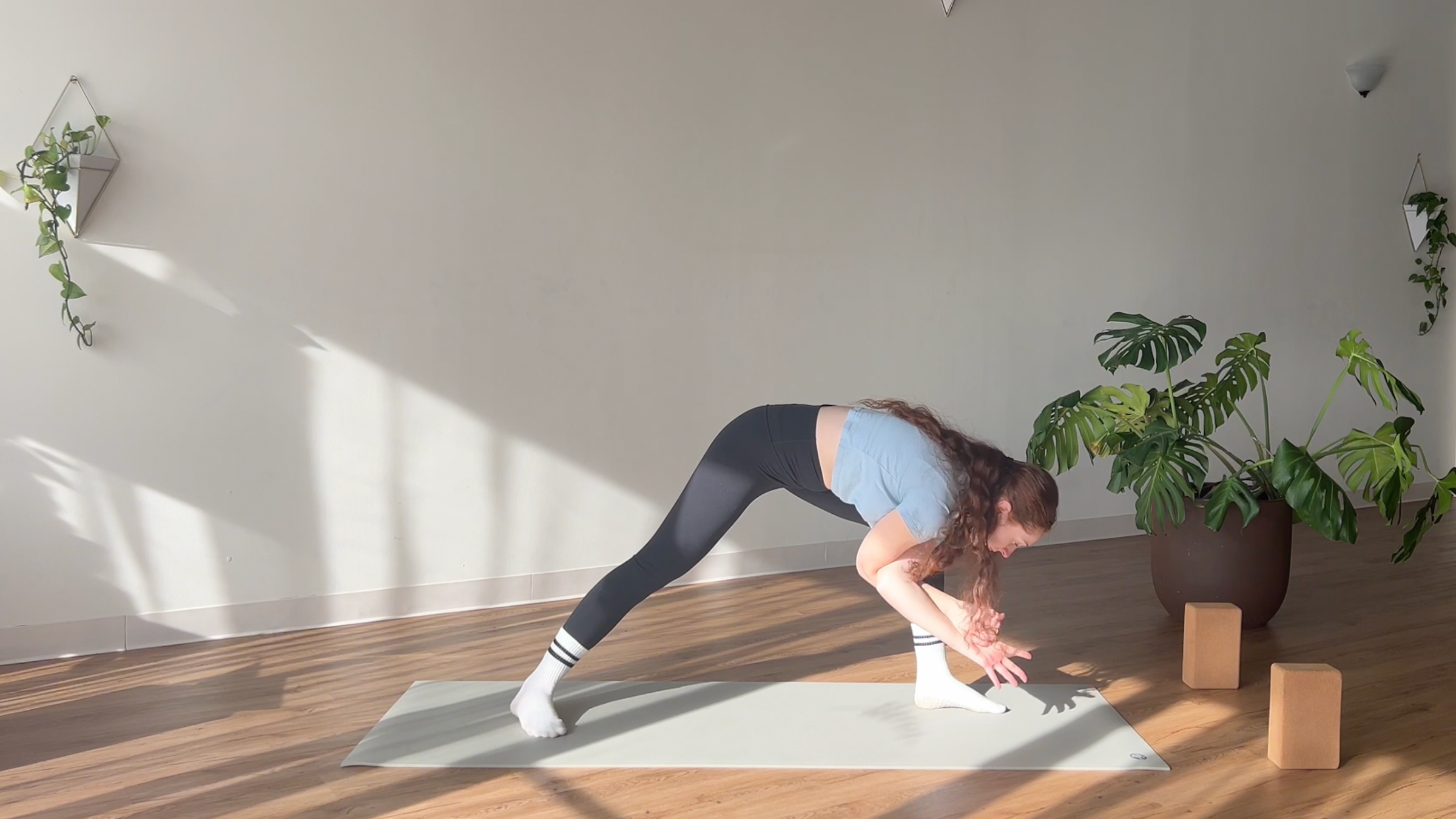 woman in Humble Warrior with Eagle Arms pose on yoga mat