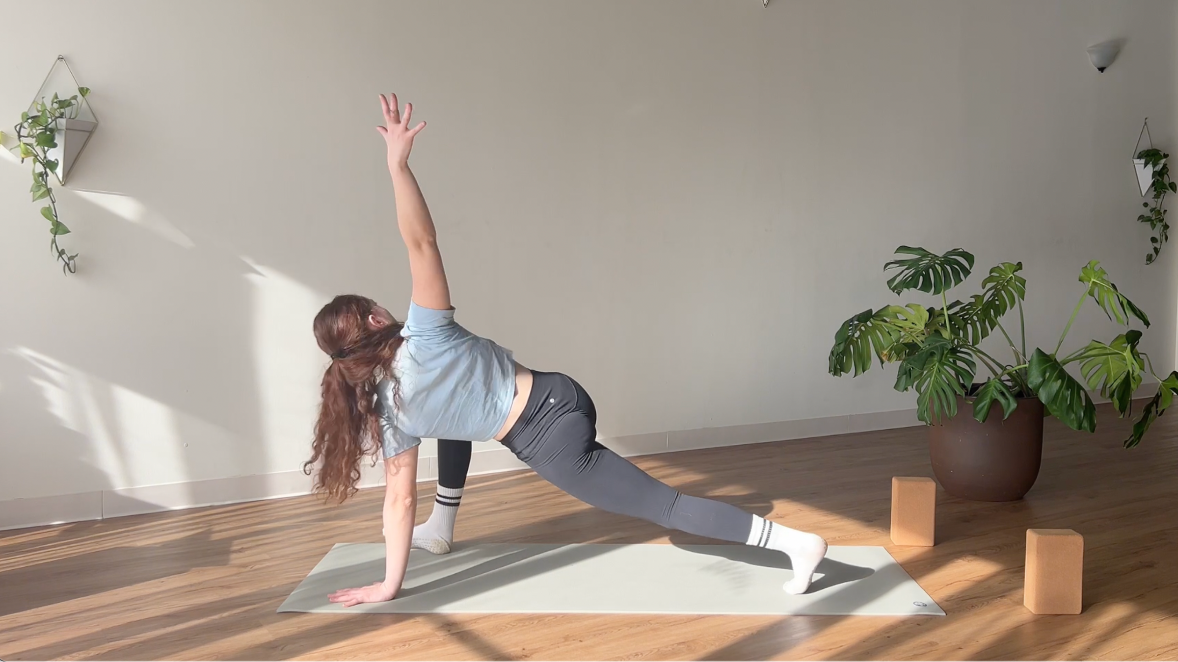 woman in Low Lunge Twist pose on yoga mat