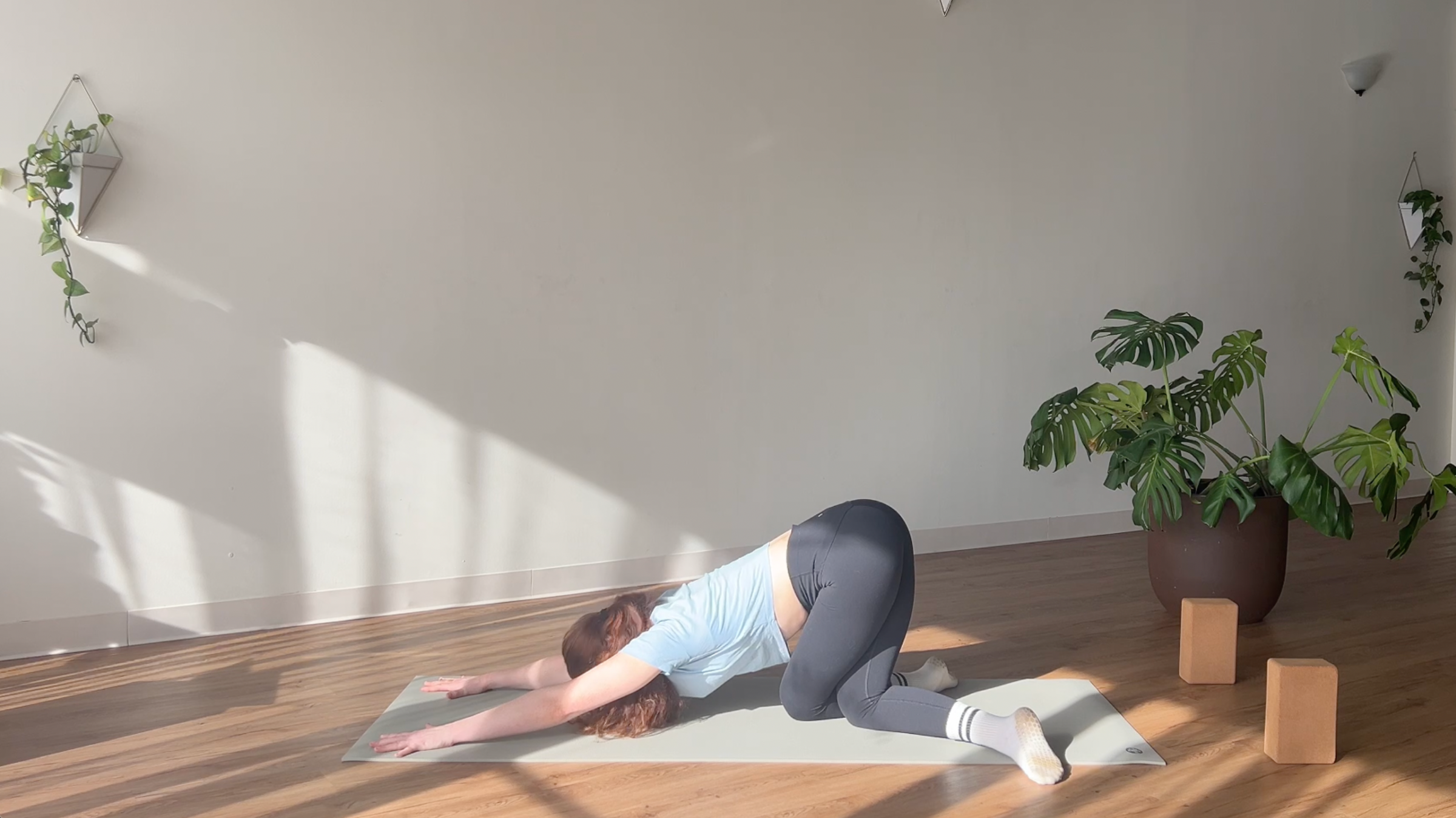 Child’s Pose With Cow-Face Legs pose