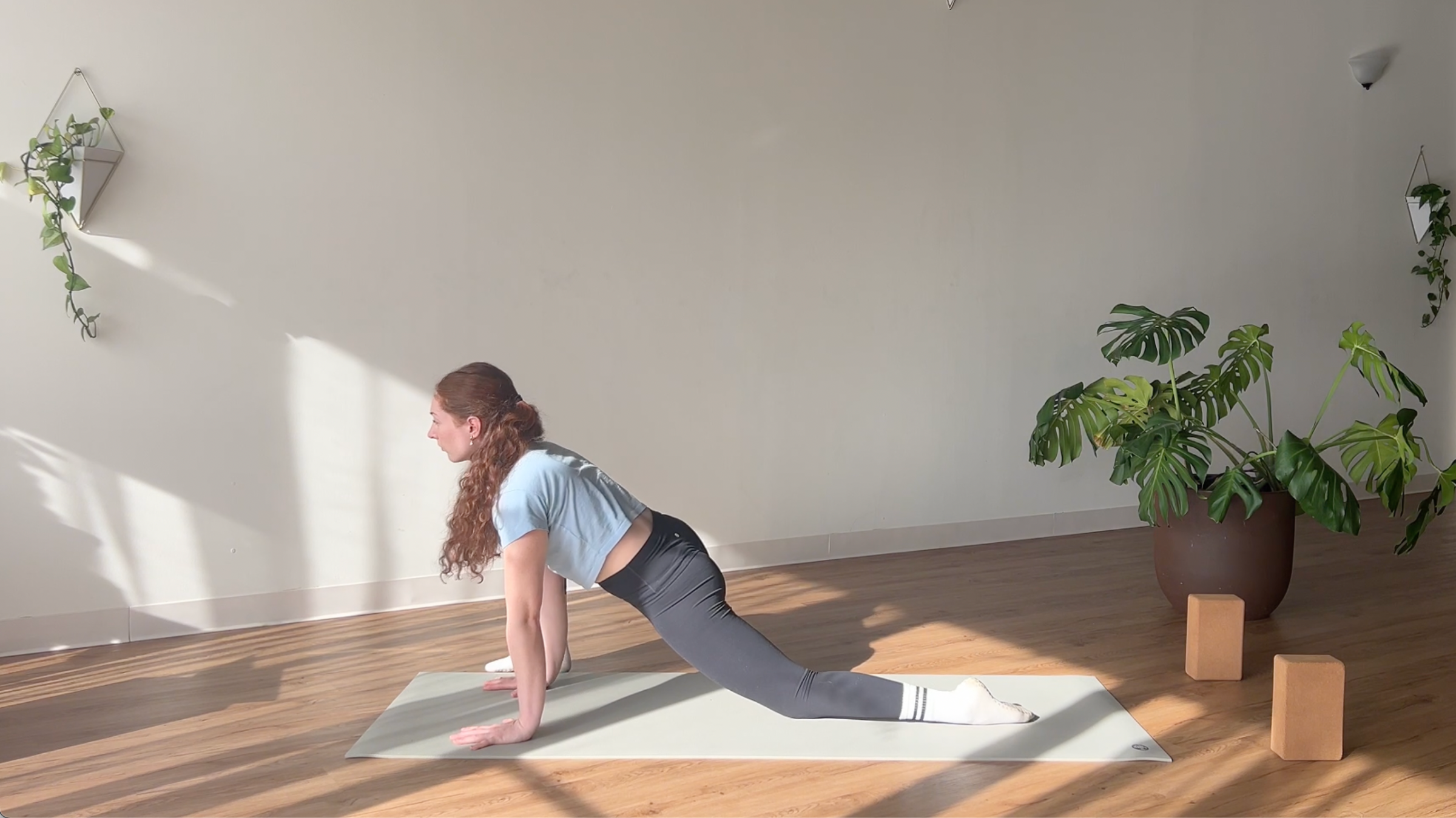 woman in Lizard Lunge pose on yoga mat