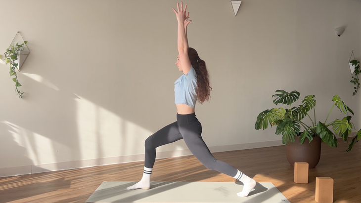 woman in High Lunge pose on yoga mat