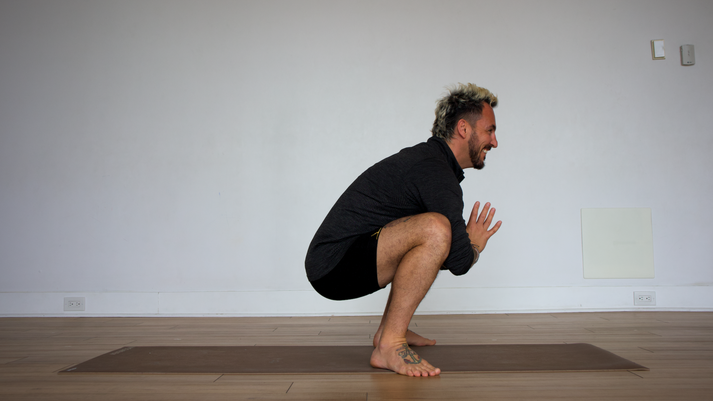 Man in Yogi's Squat pose
