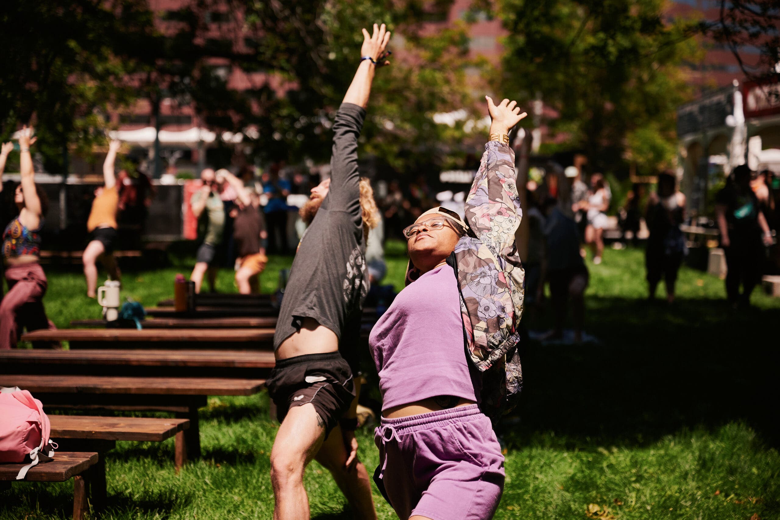 students practicing yoga at this year's outside festival