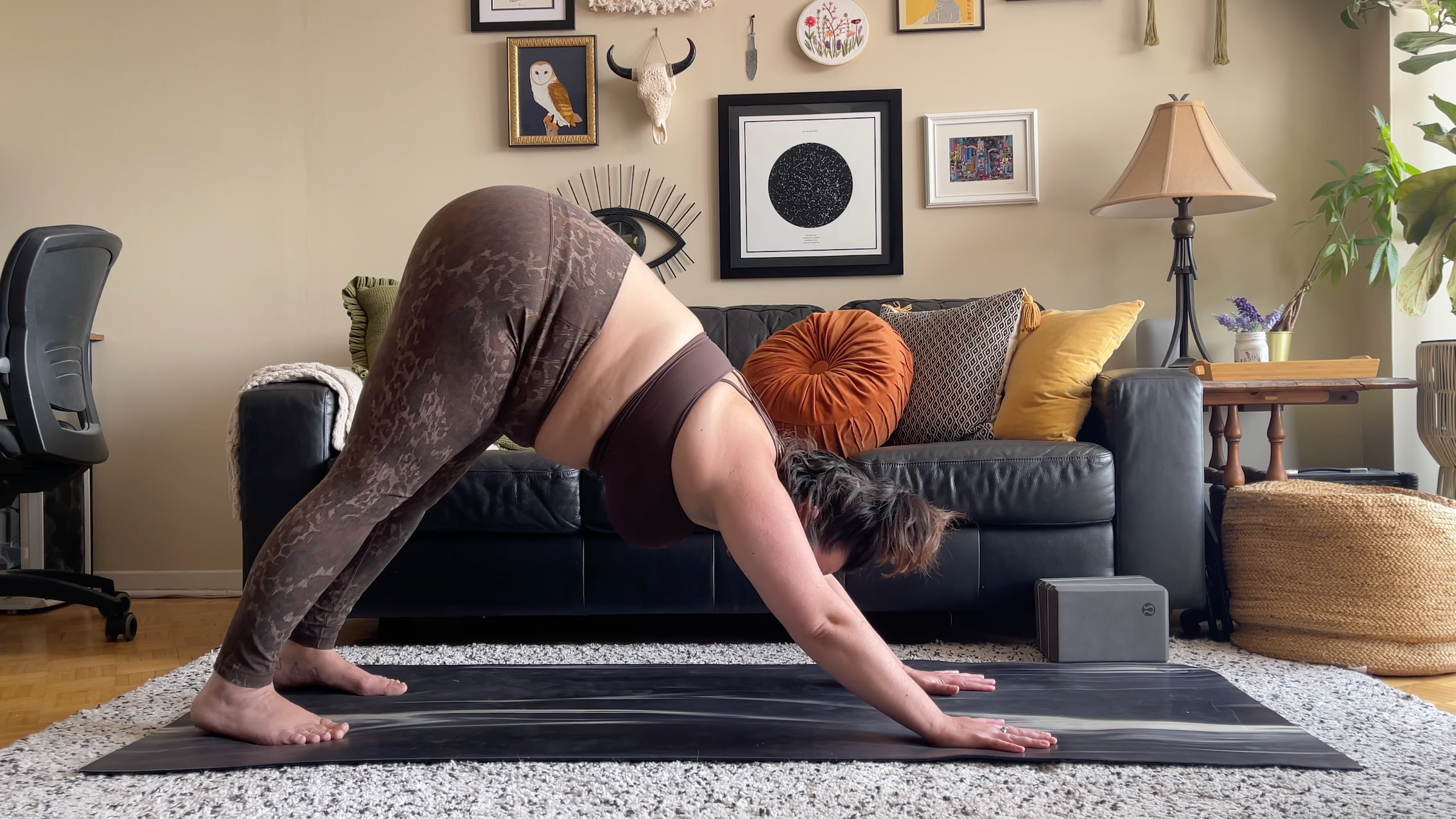 yoga teacher taylor lorenz in downward-facing dog
