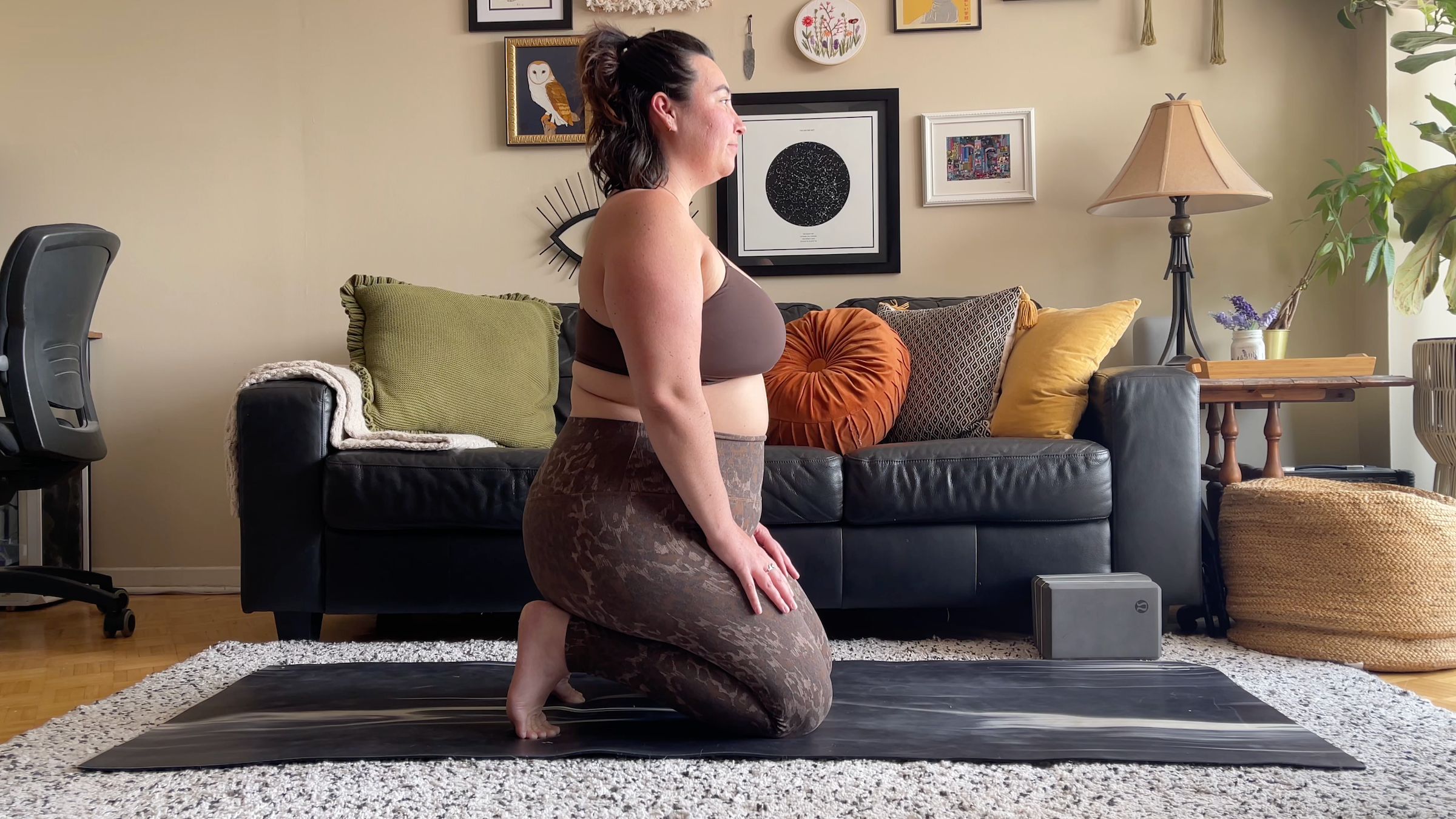 yoga teacher taylor lorenz in kneeling toe stretch, a yin yoga pose