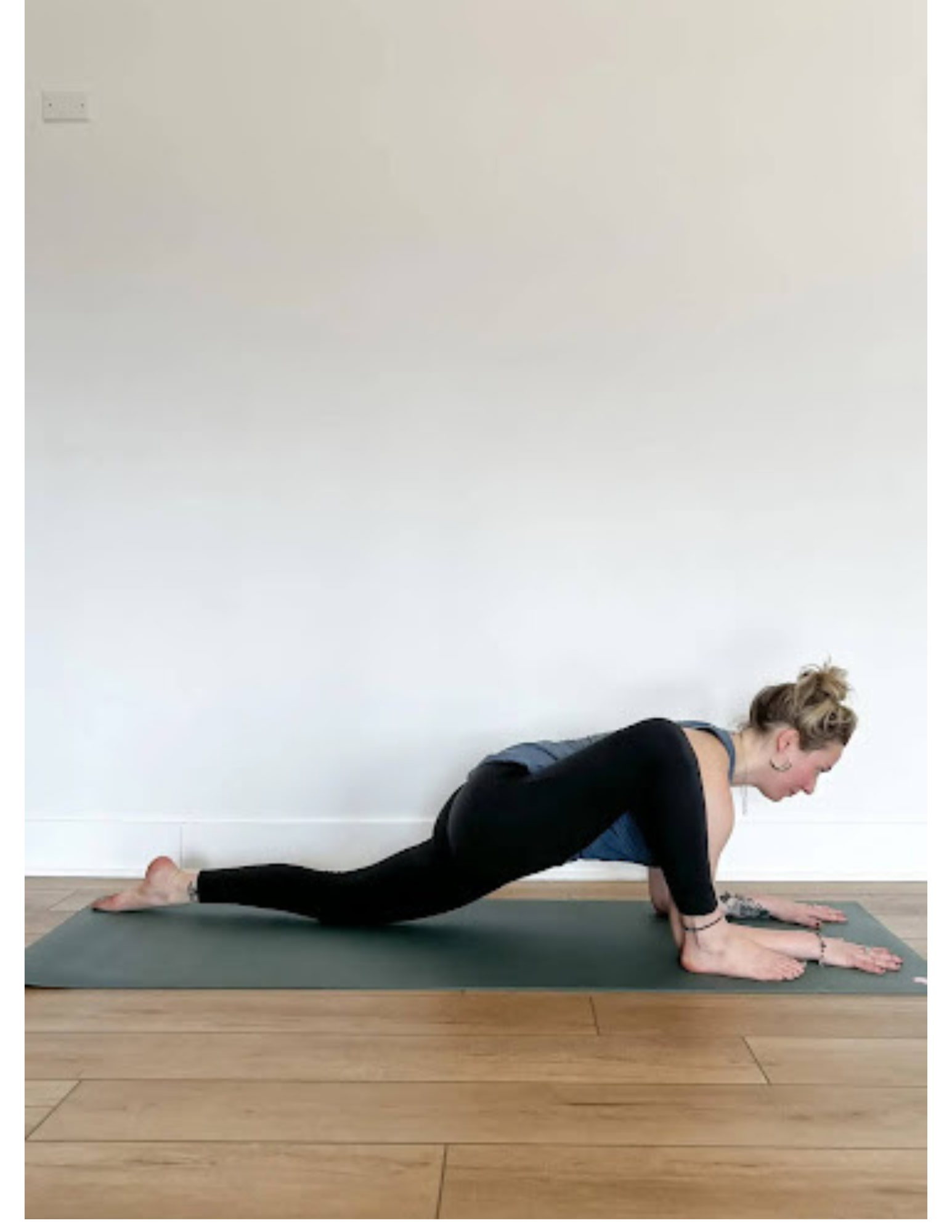 Yoga teacher Lisa Bermudez demonstrating yoga for skydivers in Lizard Pose