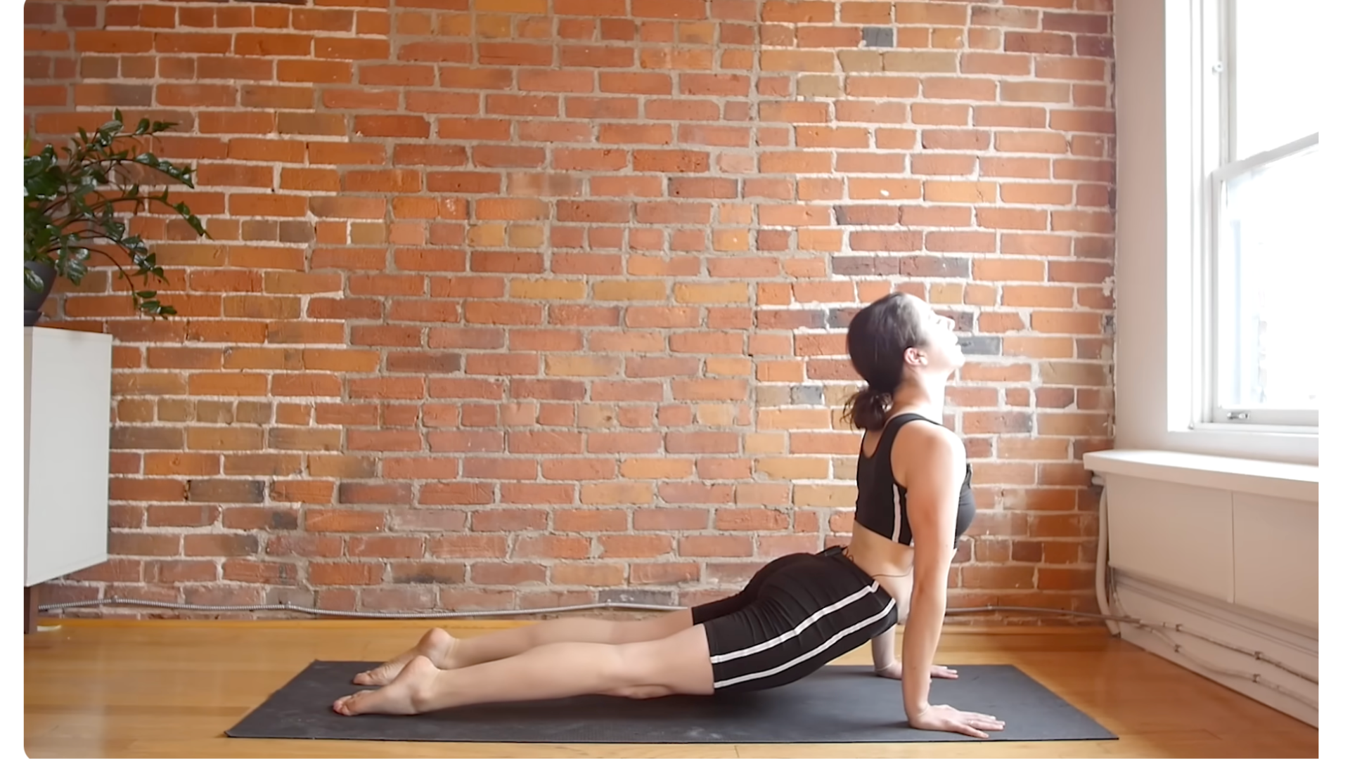 Yoga teacher practicing a backbend during a 10-minute morning yoga stretches with a focus on full-body stretch