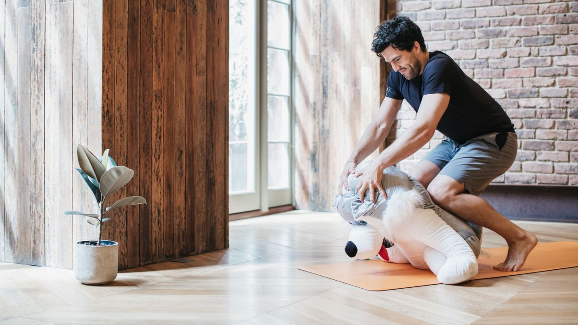 Yoga teacher demonstrating hands-on adjustments in yoga