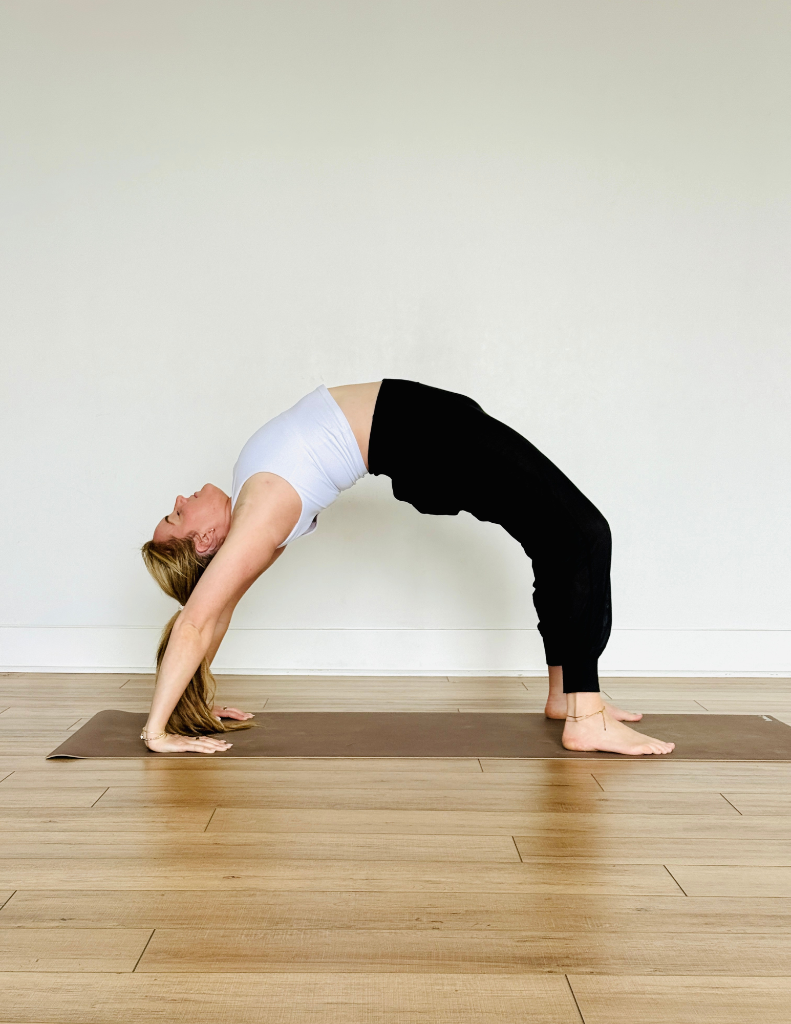 Yoga teacher Kate Lombardo practicing full Wheel Pose