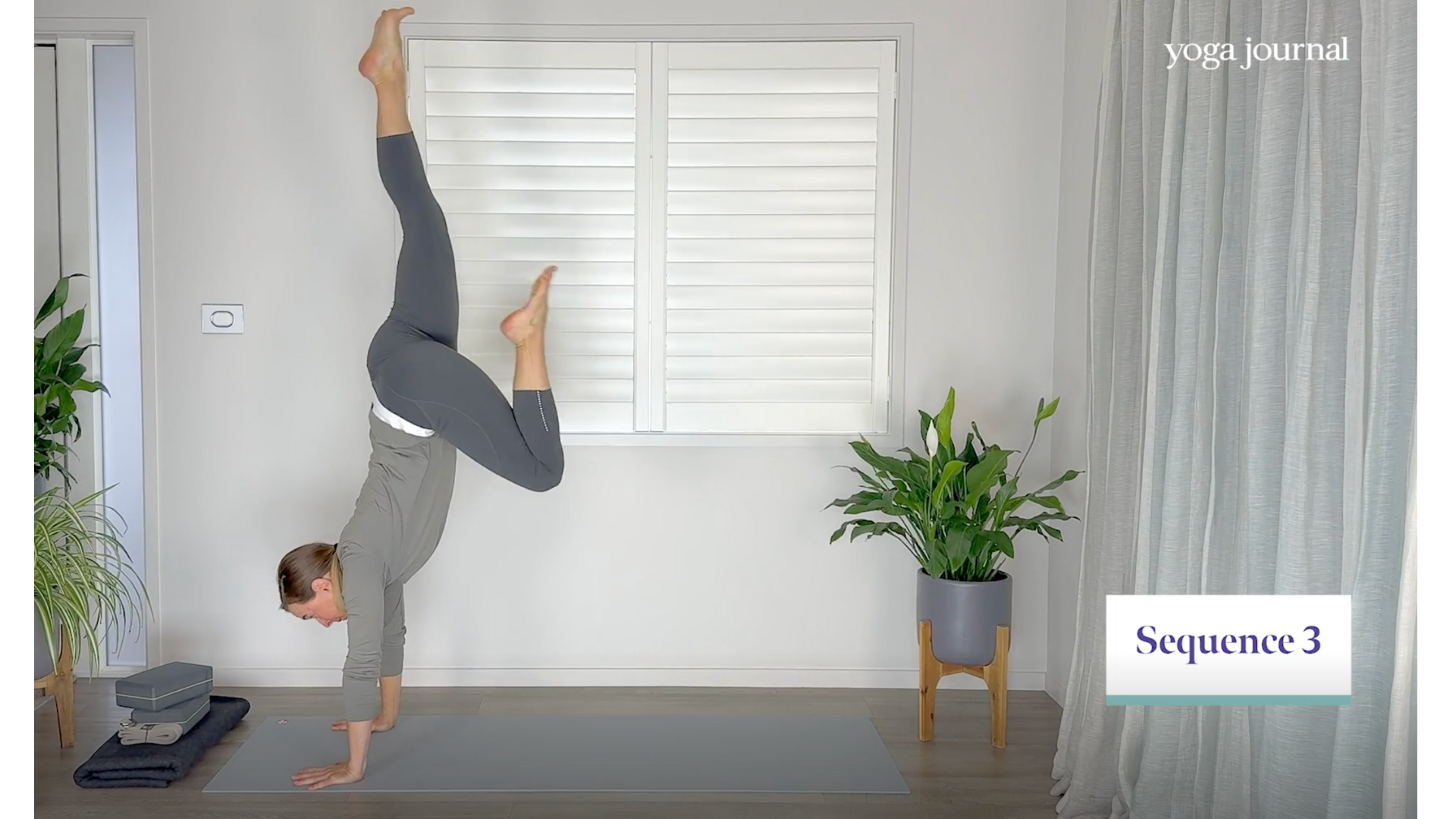 Yoga teacher practicing Handstand prep in response to the question, Does yoga count as cardio?