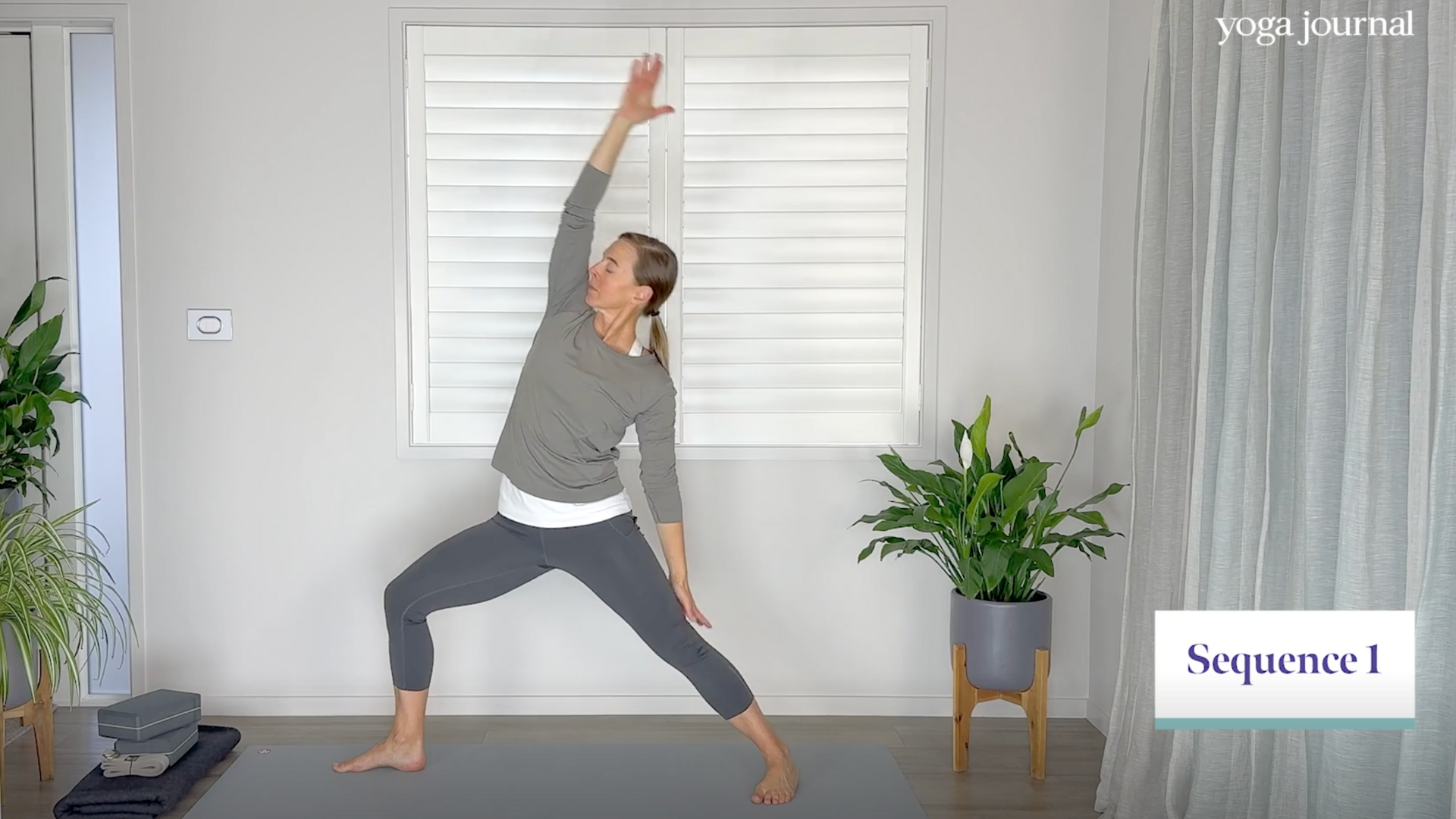 Yoga teacher answering the question "Is yoga cardio?" by practicing a sequence of yoga cardio exercises