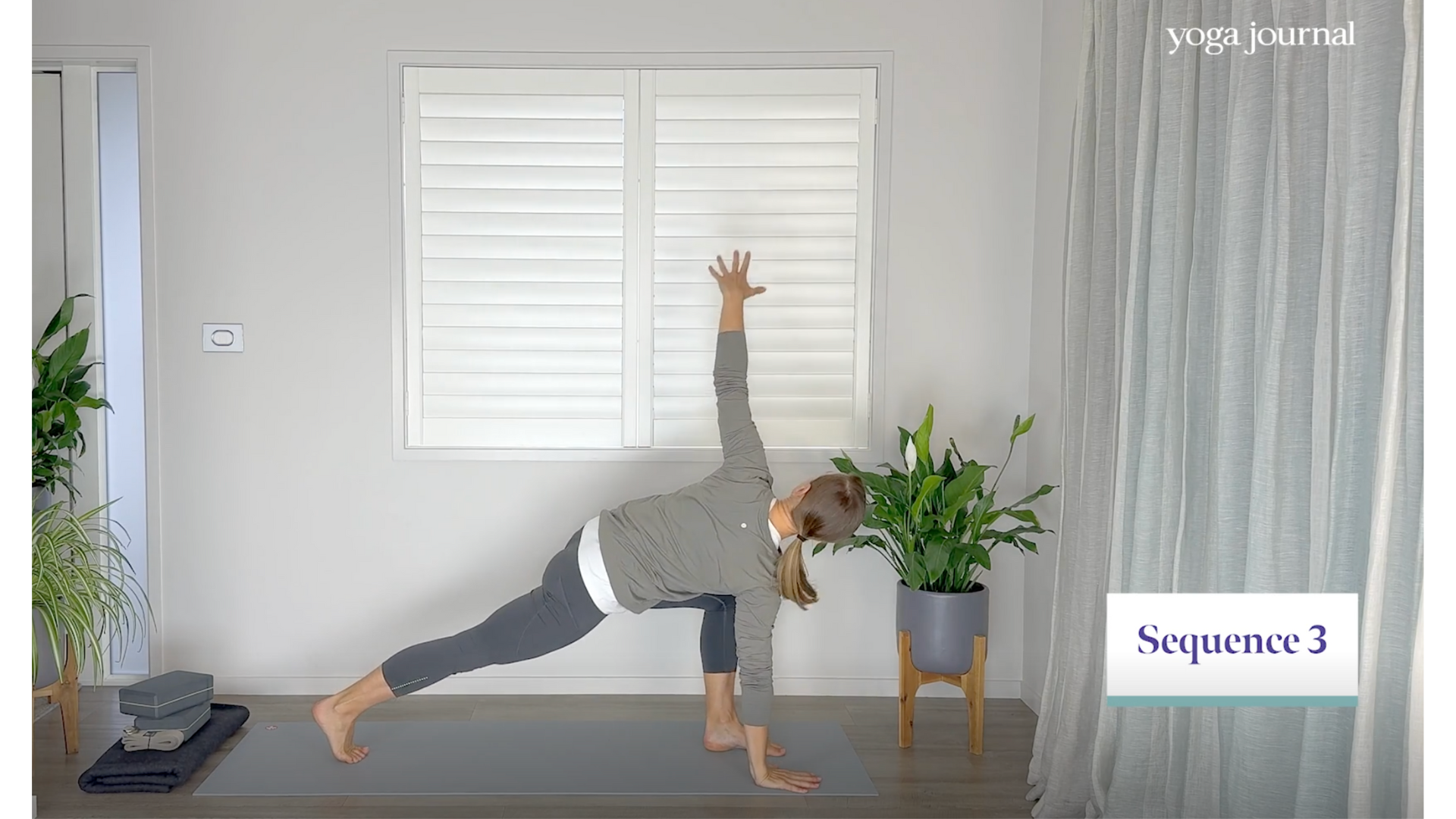 Yoga teacher practicing Revolved Lunge in a yoga cardio exercise sequence