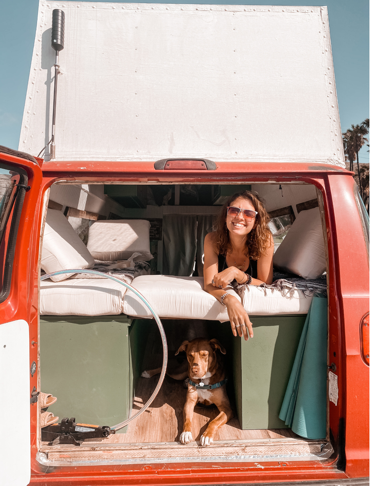 Writer Sierra Vandervort showing off her Dodge van retrofitted for a year of van life