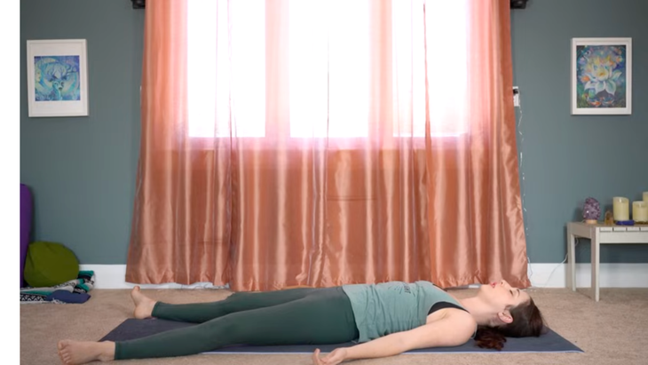 This Yin Yoga for Hips Routine Releases Unwanted Tension 6 Yoga teacher lying on a mat