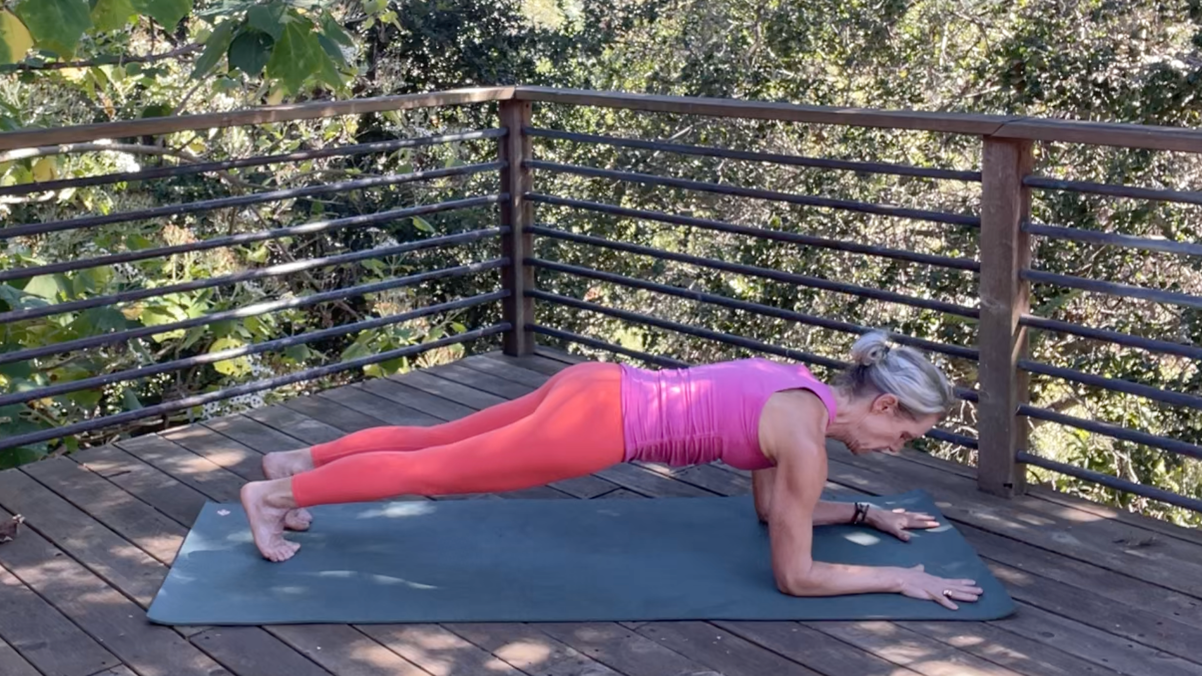 Andrea Marcum practicing Forearm Plank