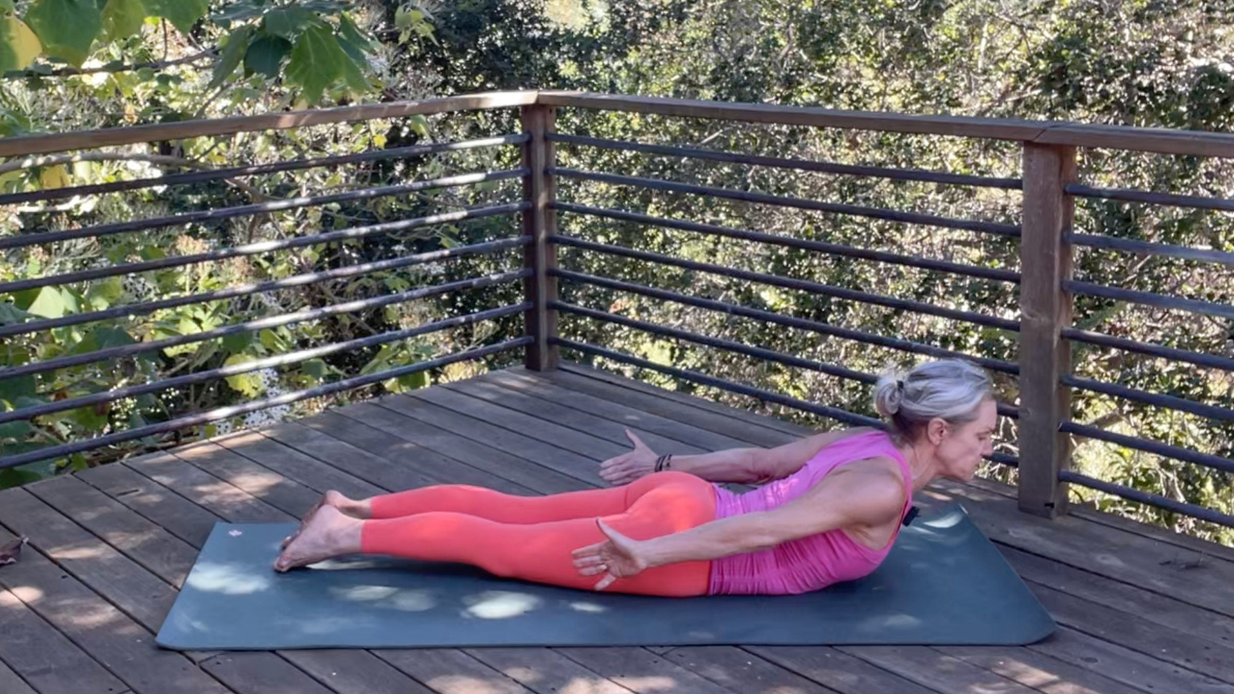 Andrea Marcum practicing Locust Pose