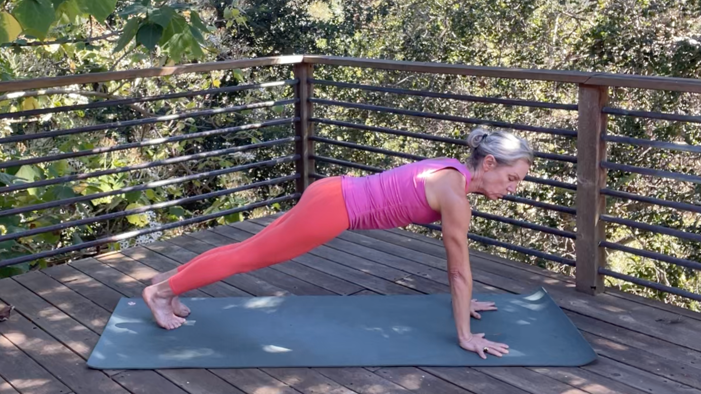 Andrea Marcum practicing Plank Pose in her yoga for strength routine