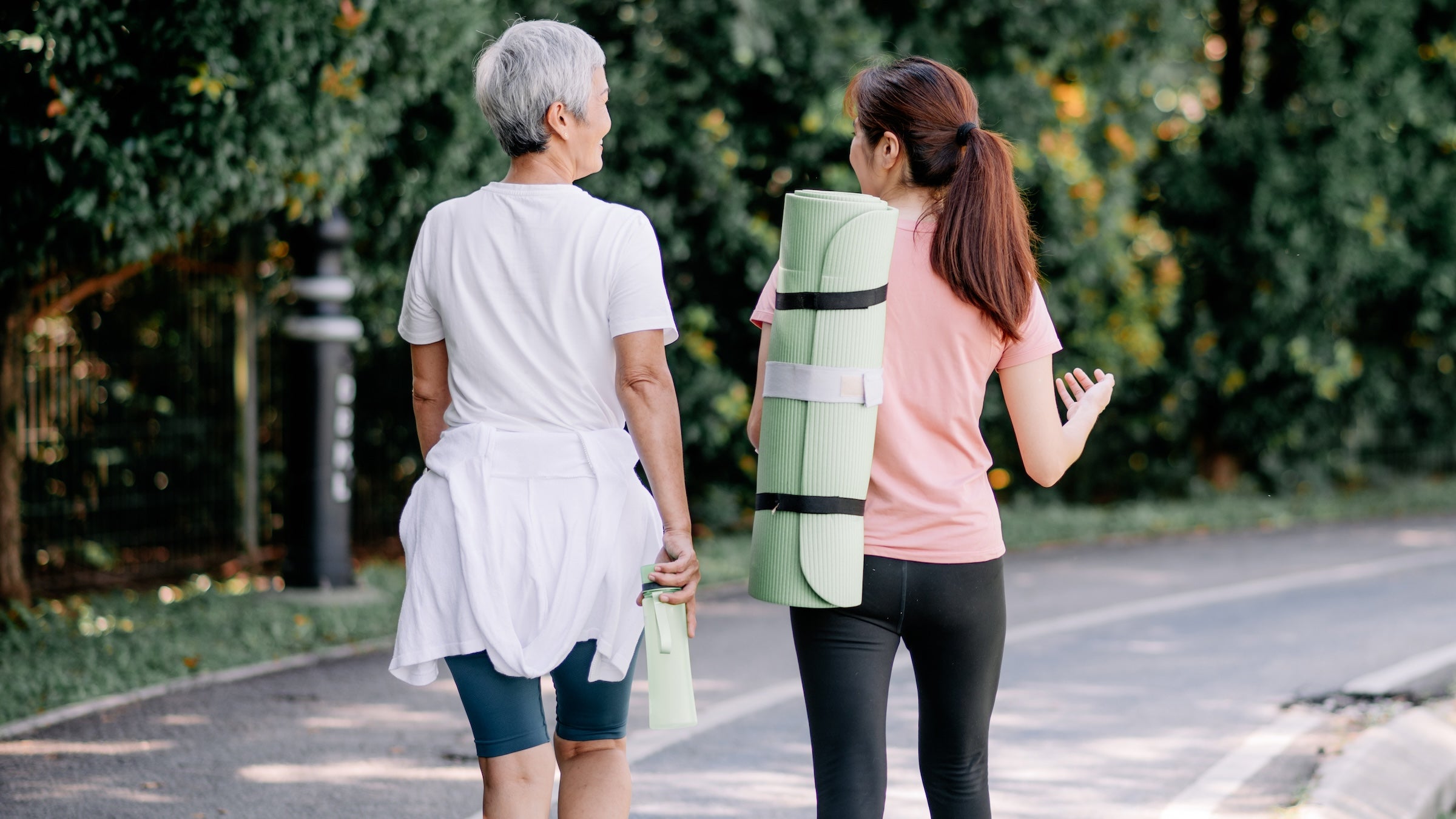 two women walking and talking yoga misconceptions