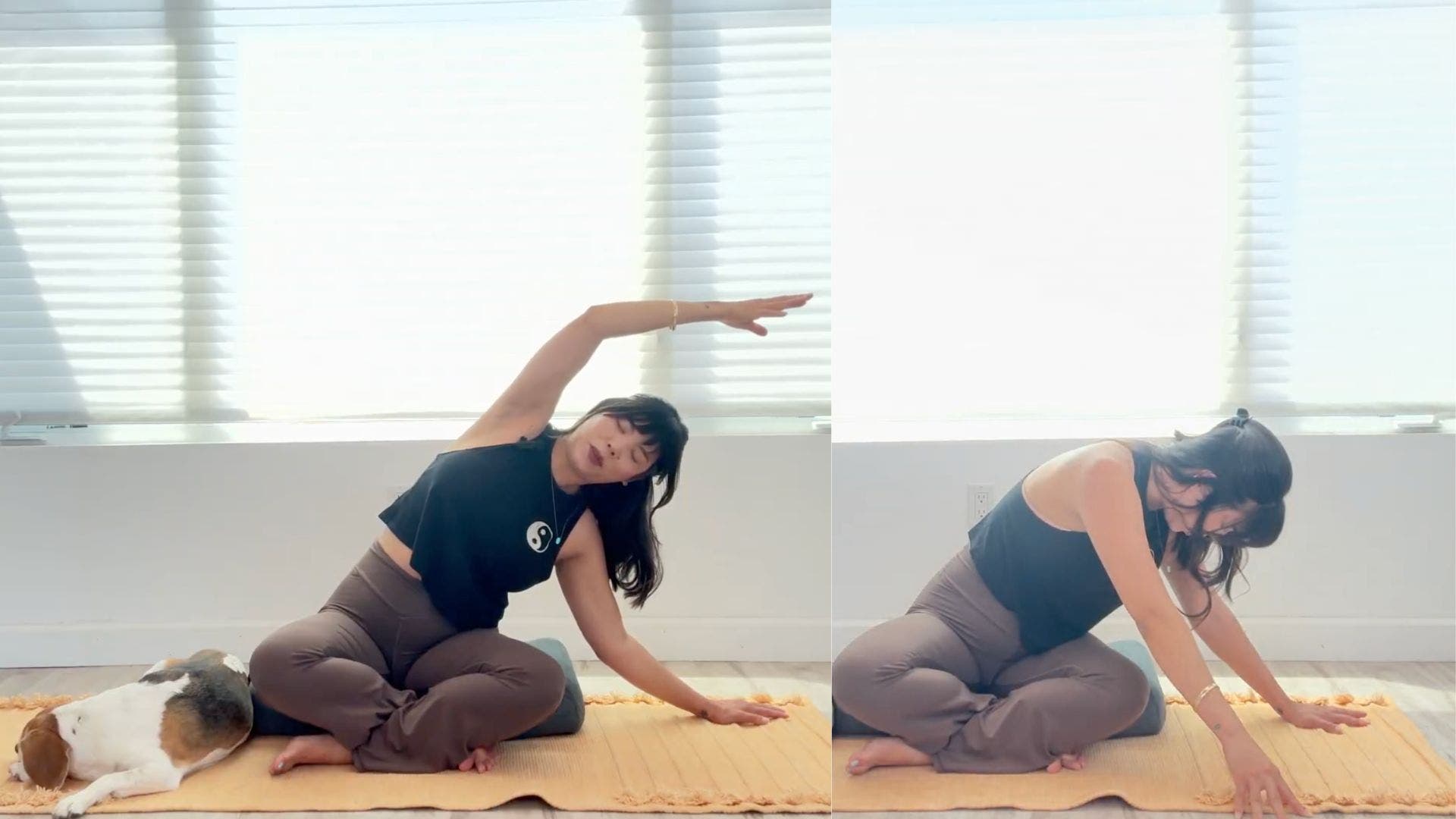 Woman sitting on yoga mat practicing seated side bend with legs crossed.