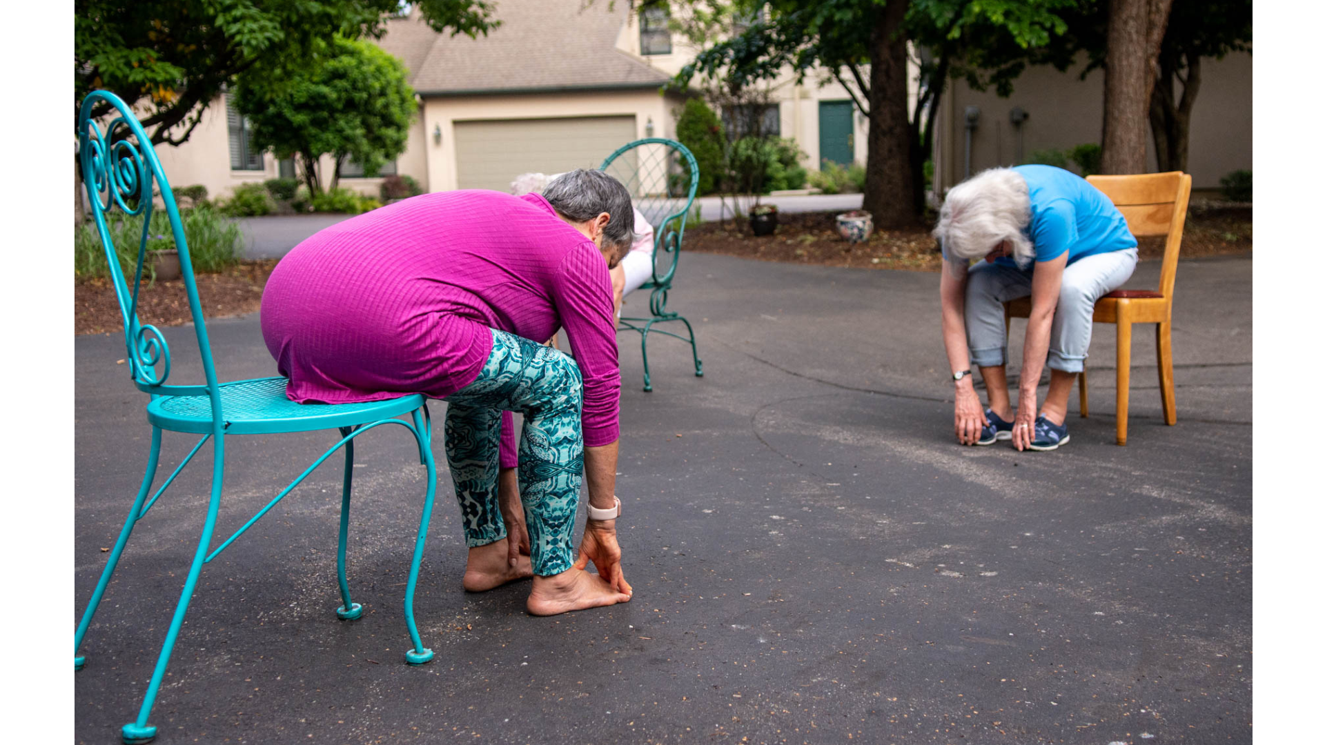 Teacher Marian Hall leading a driveway yoga class
