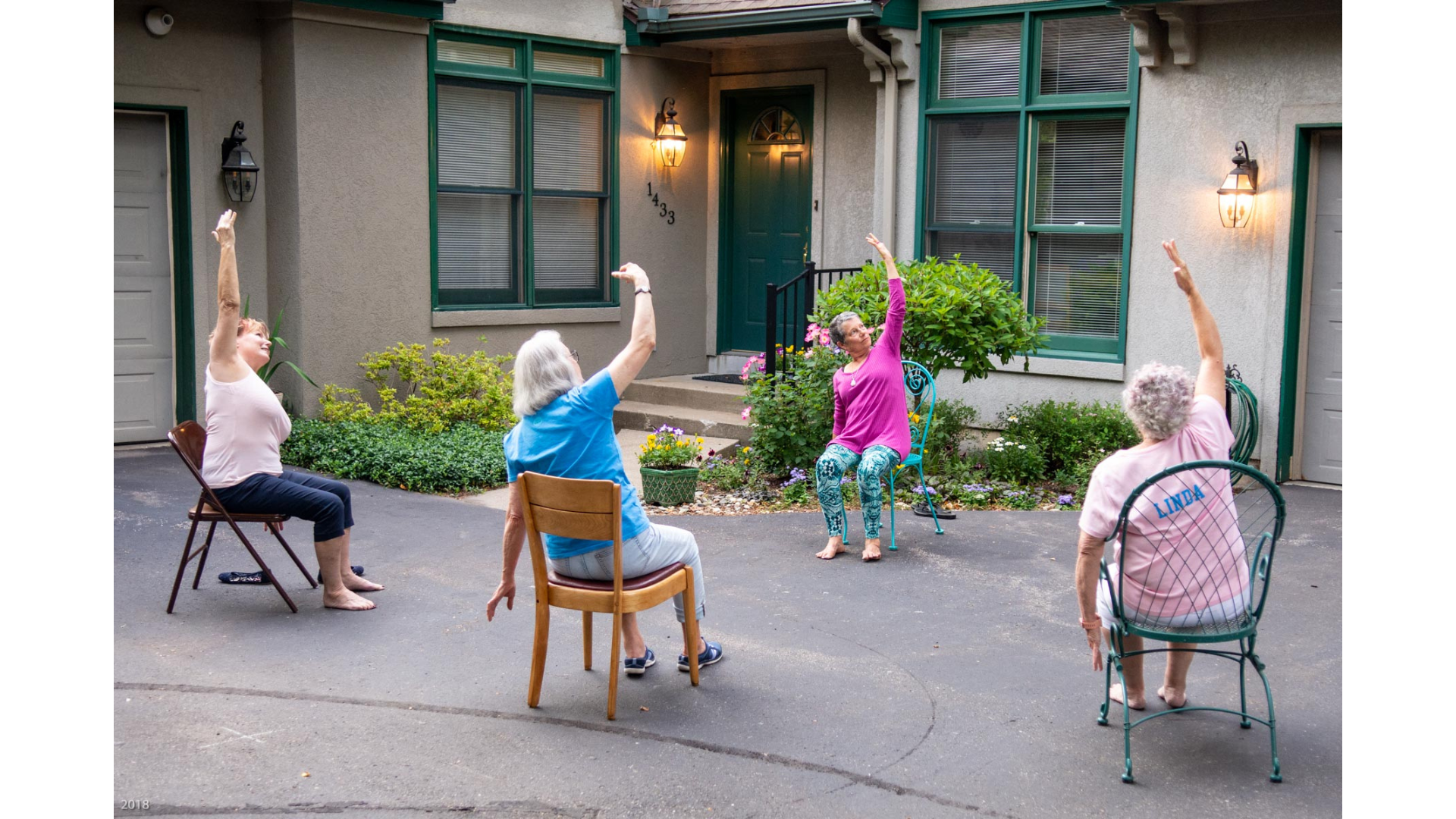 Yoga teacher Marian Hall leading driveway yoga classes