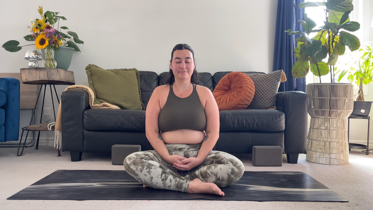 Yoga teacher Taylor Lorenz ends her practice in Easy Seat