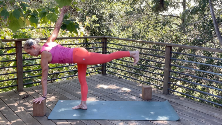 Yoga teacher Andrea Marcum in Twisting Half Moon