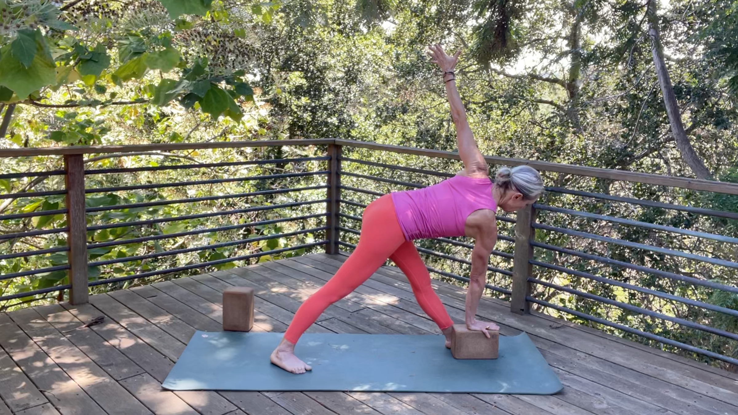 Yoga teacher Andrea Marcum in Twisting Triangle
