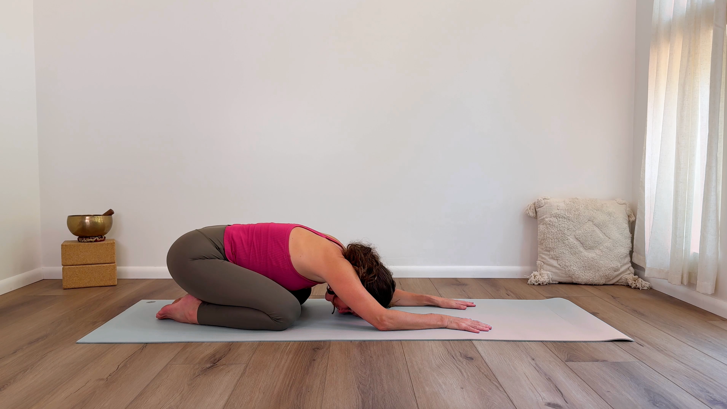 Yoga teacher Devi Daly in Child's Pose