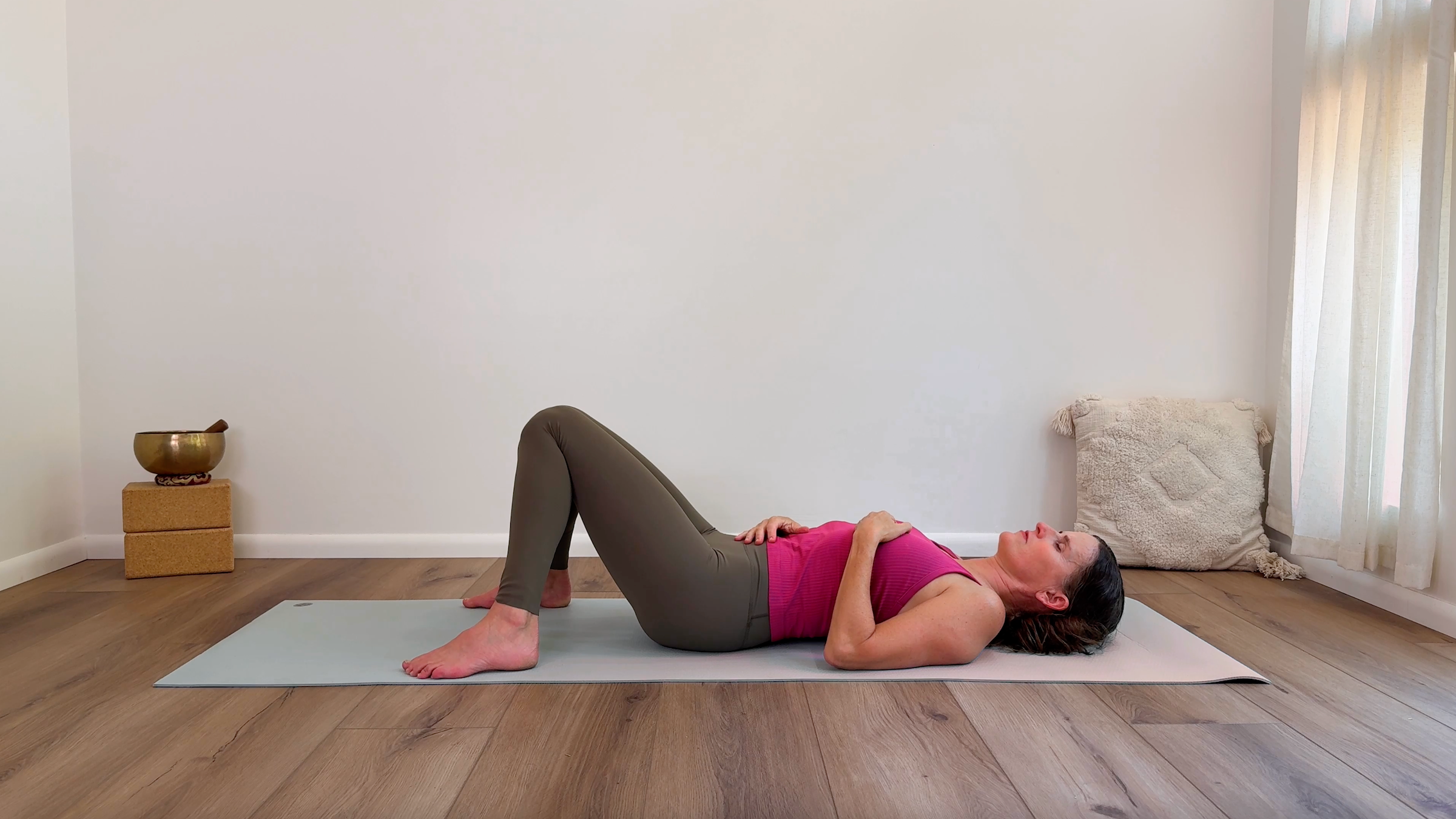 Yoga teacher Devi Daly leads a somatic yoga practice in Constructive Rest