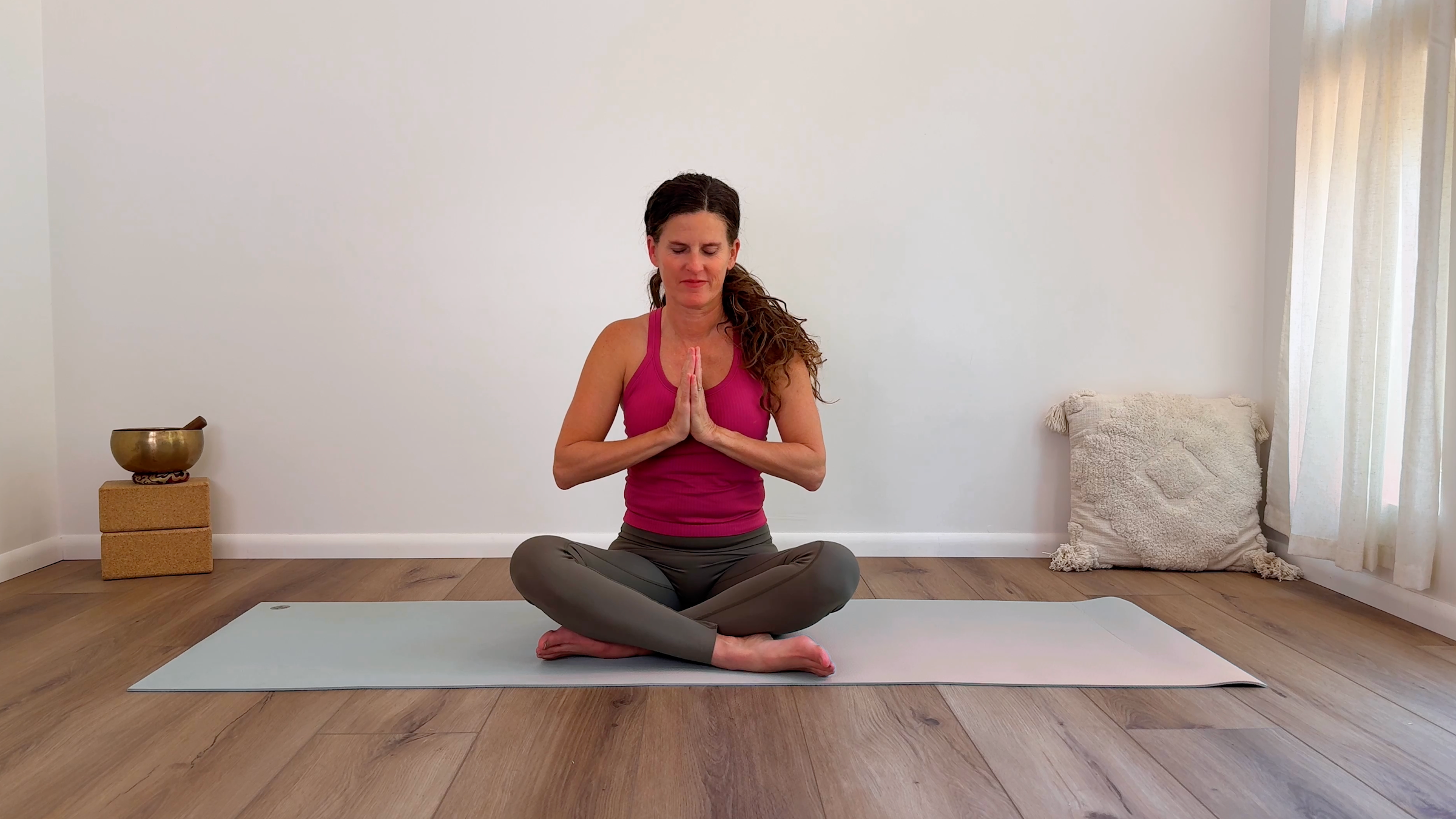 Yoga teacher Devi Daly in Easy Pose