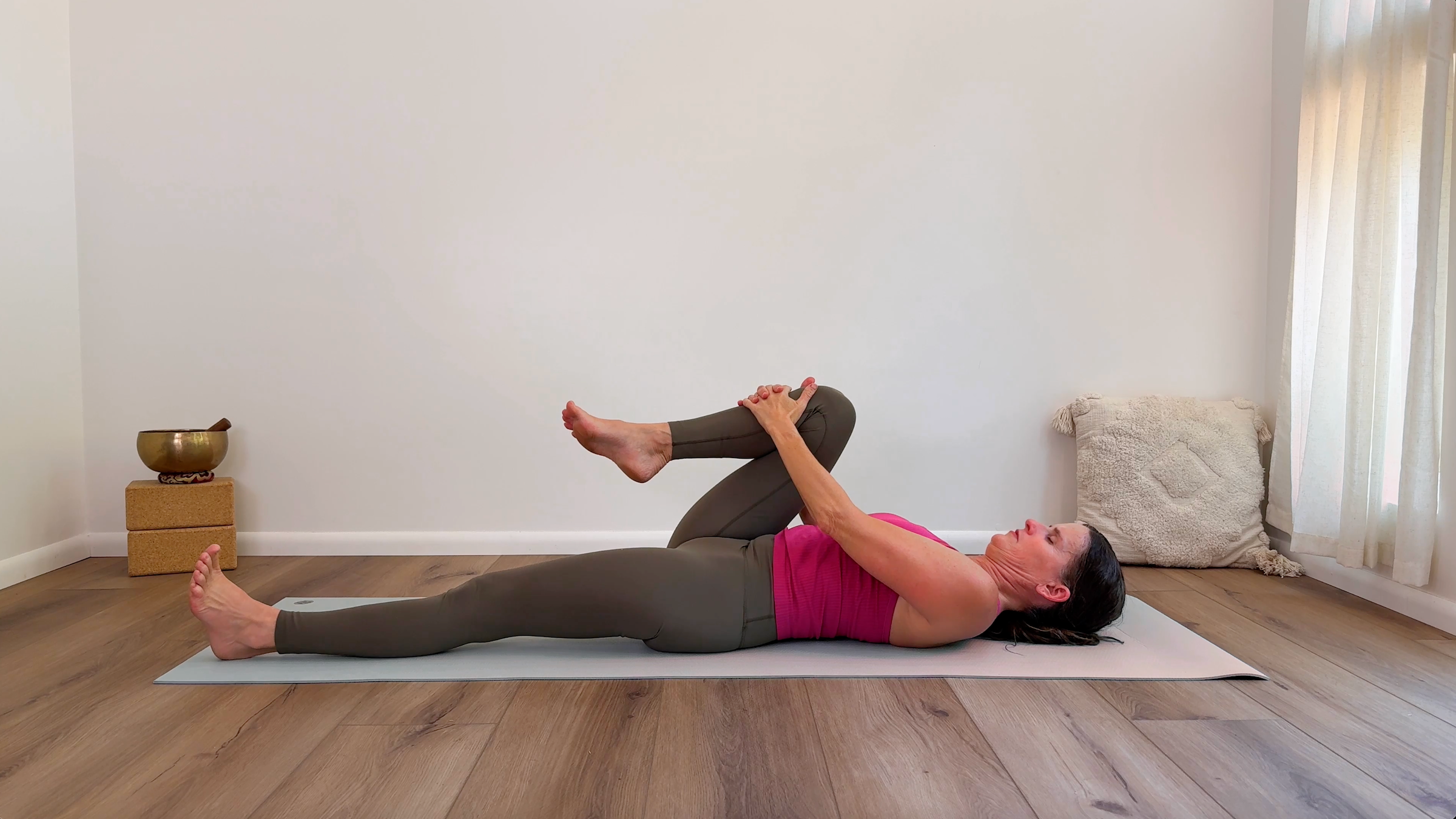 Yoga teacher Devi Daly in Half Knee-to-Chest