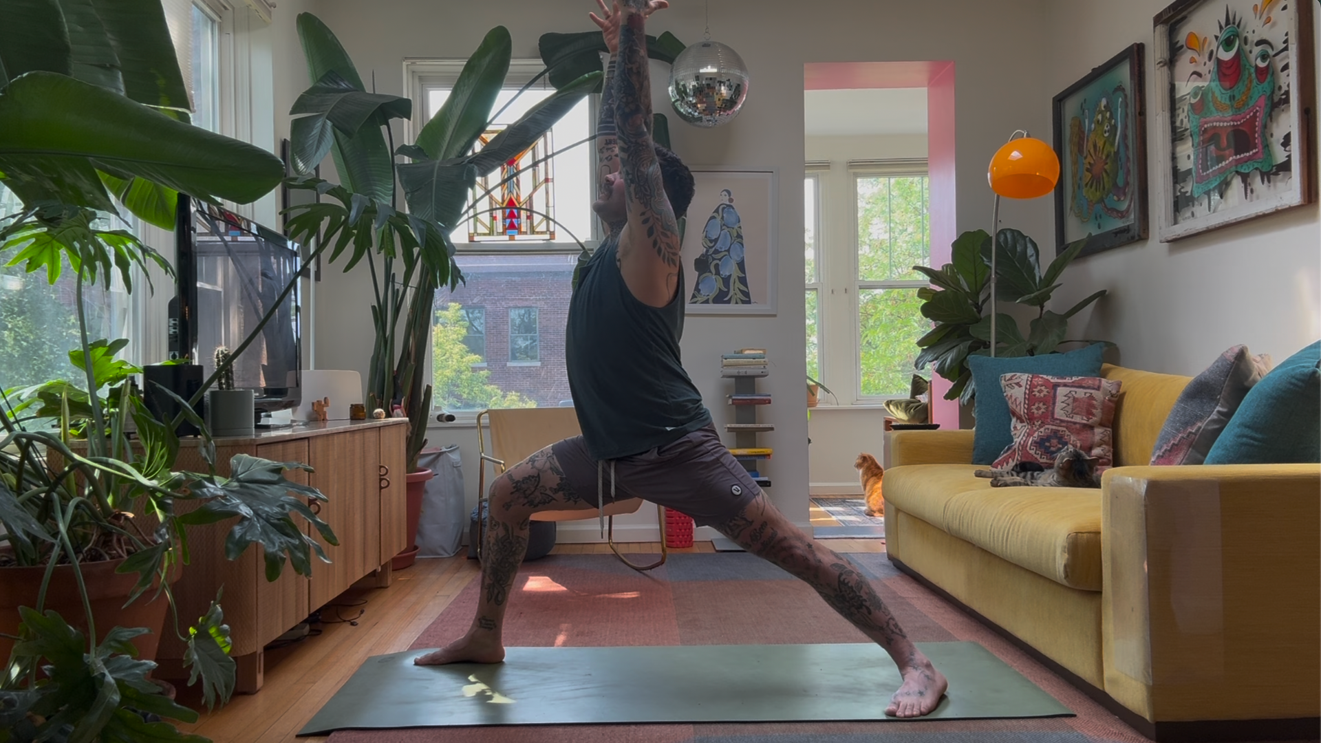 Warrior 1 Pose being taught by a yoga teacher