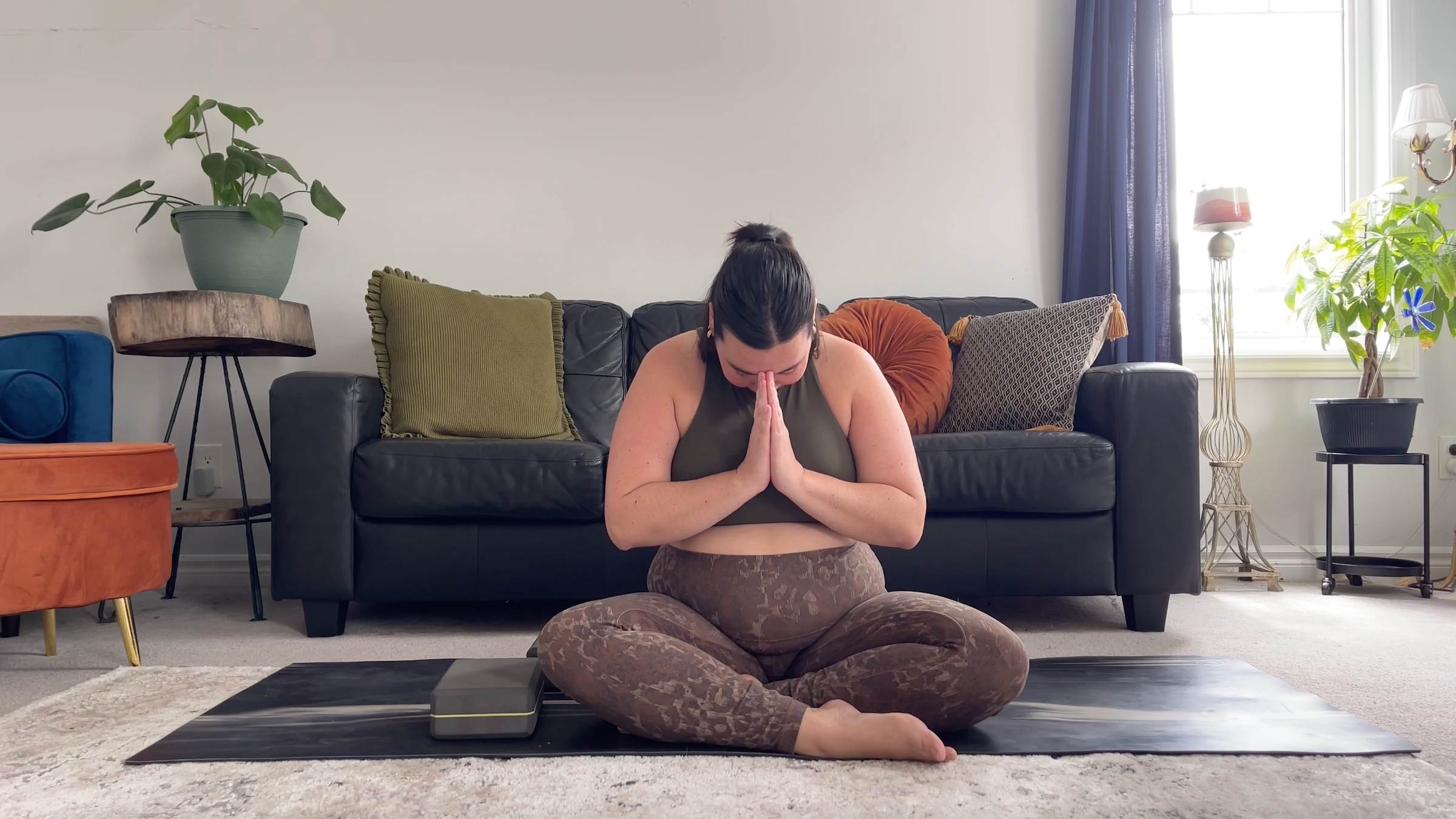 Yoga teacher Taylor Lorenz in Easy Seat to end her yin yoga practice