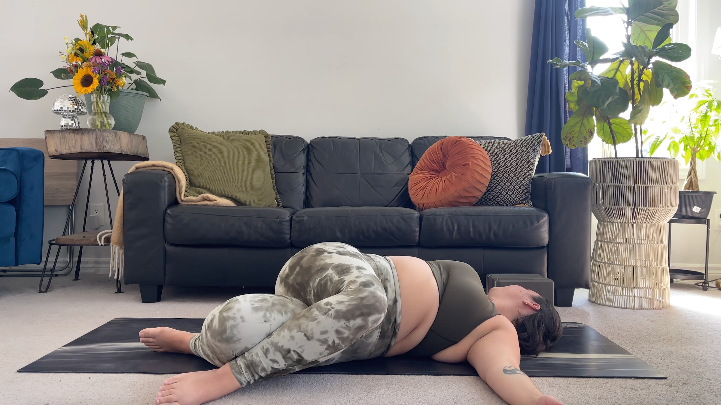Yoga teacher Taylor Lorenz in Supine Twist