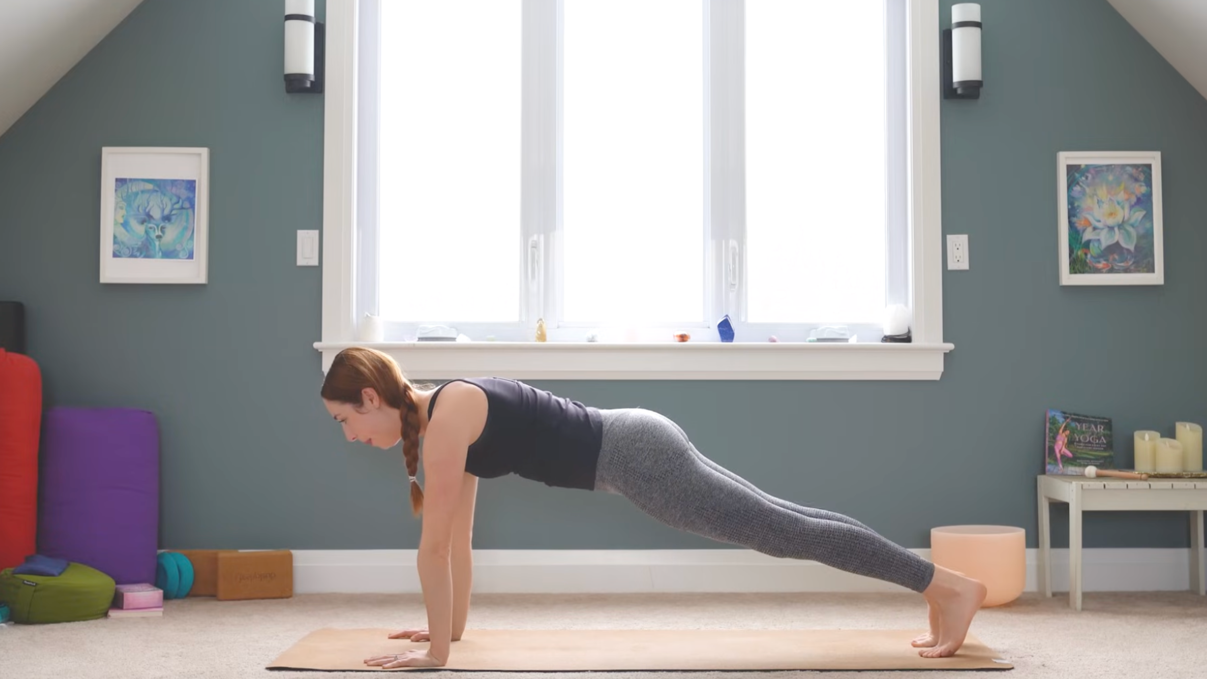 woman in plank pose on yoga mat in home during anterior pelvic tilt exercises