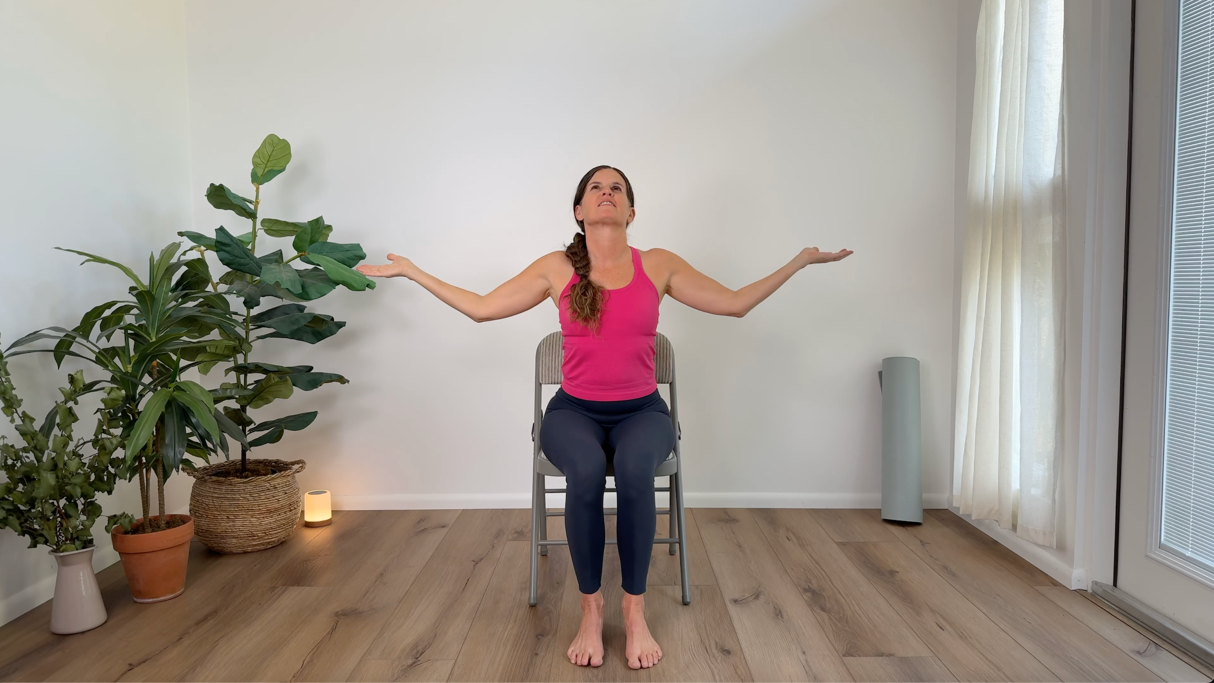 Teacher Devi Daly in Self-Hug, part of her chair yoga practice