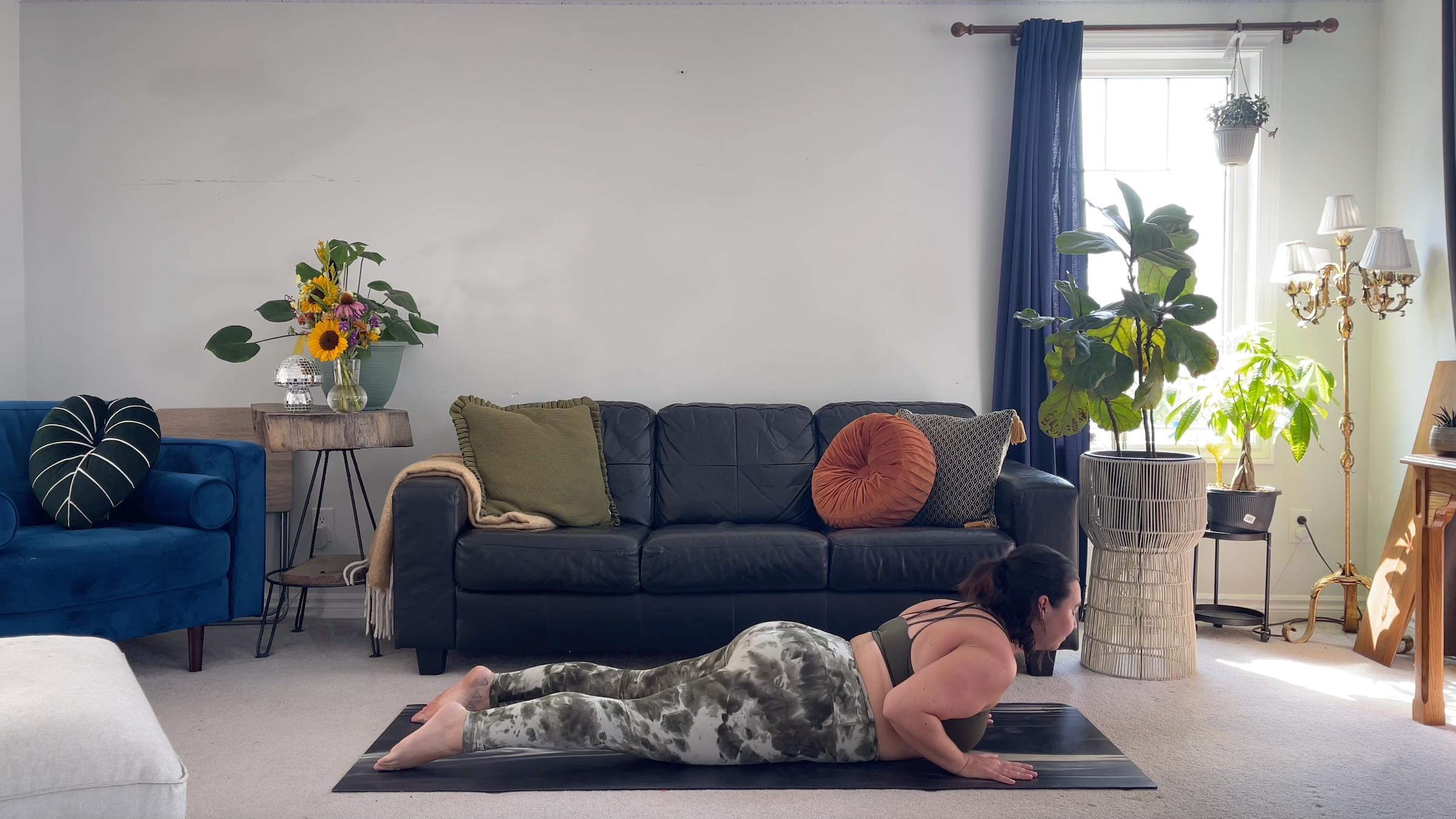 Yoga teacher Taylor Lorenz in Baby Cobra, part of her morning yoga practice