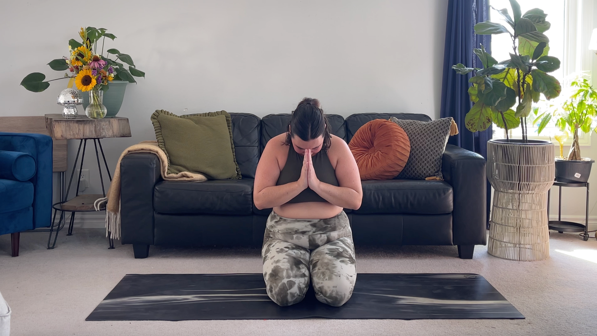 Yoga teacher Taylor Lorenz in Kneeling to close out her morning yoga practice
