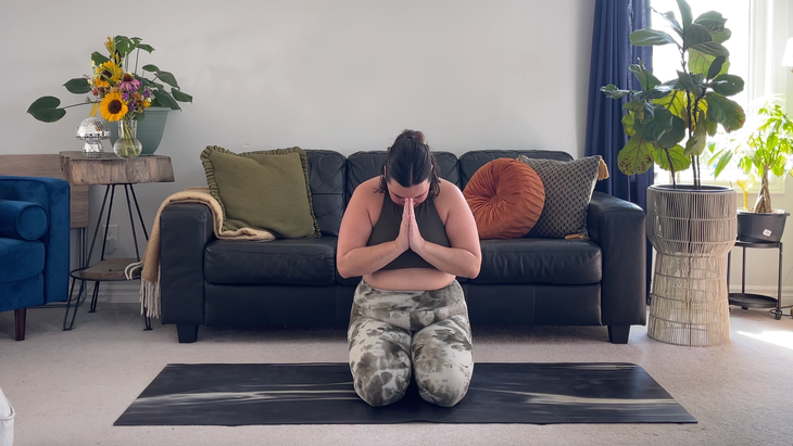 Yoga teacher Taylor Lorenz in Kneeling to close out her morning yoga practice