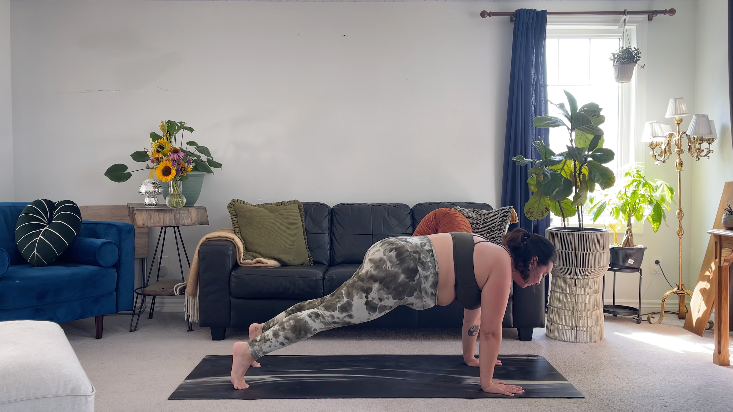 Yoga teacher Taylor Lorenz in Plank Pose