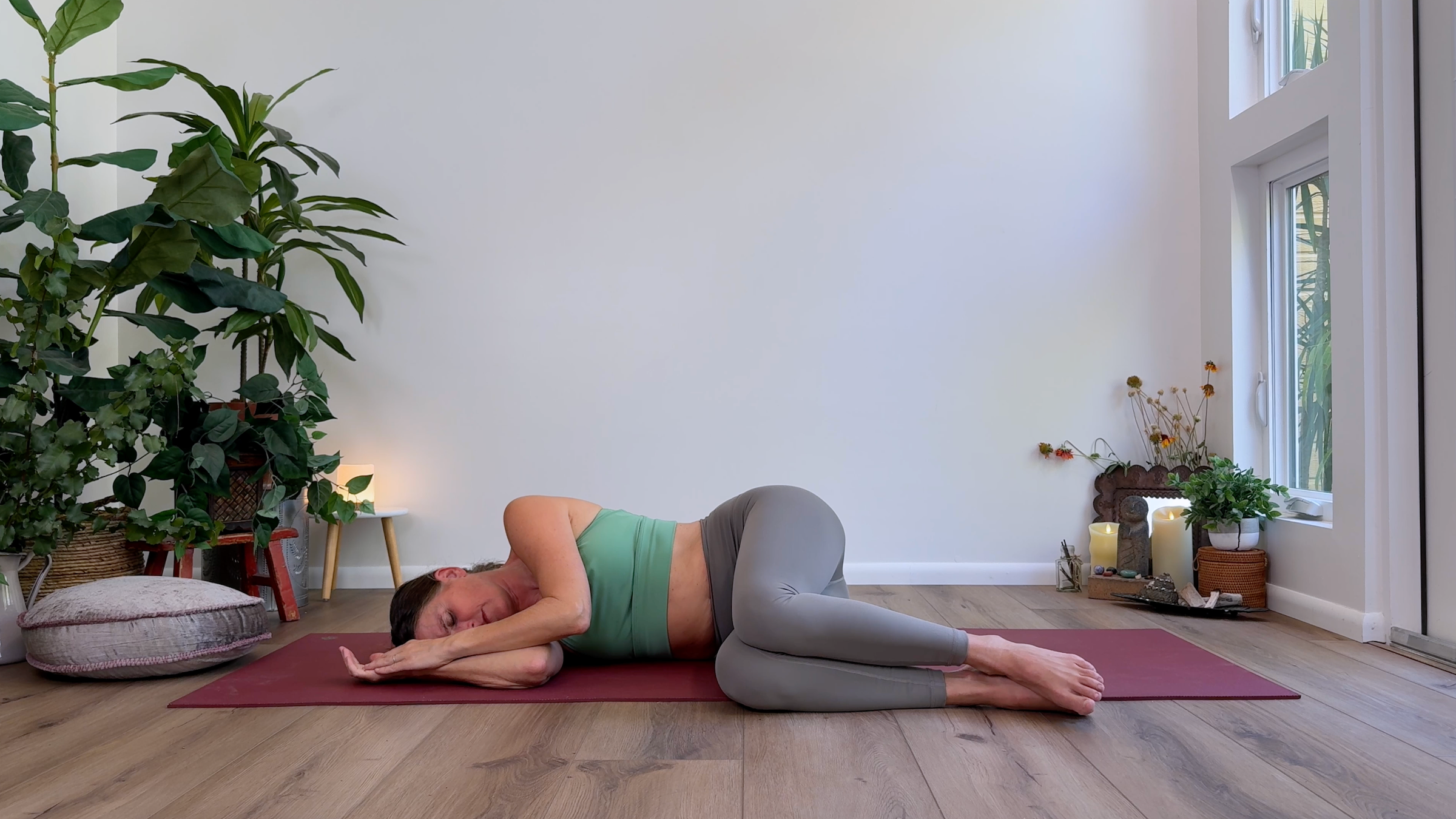 Yoga teacher Devi Daly in Fetal Pose, part of her Yin yoga practice
