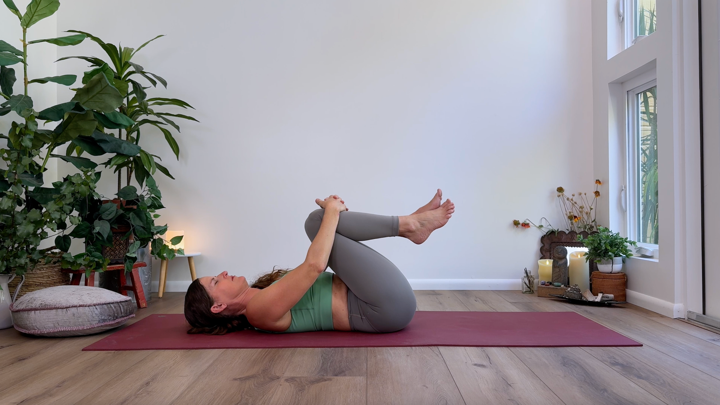 Yoga teacher Devi Daly in Knees to Chest, part of her Yin yoga practice