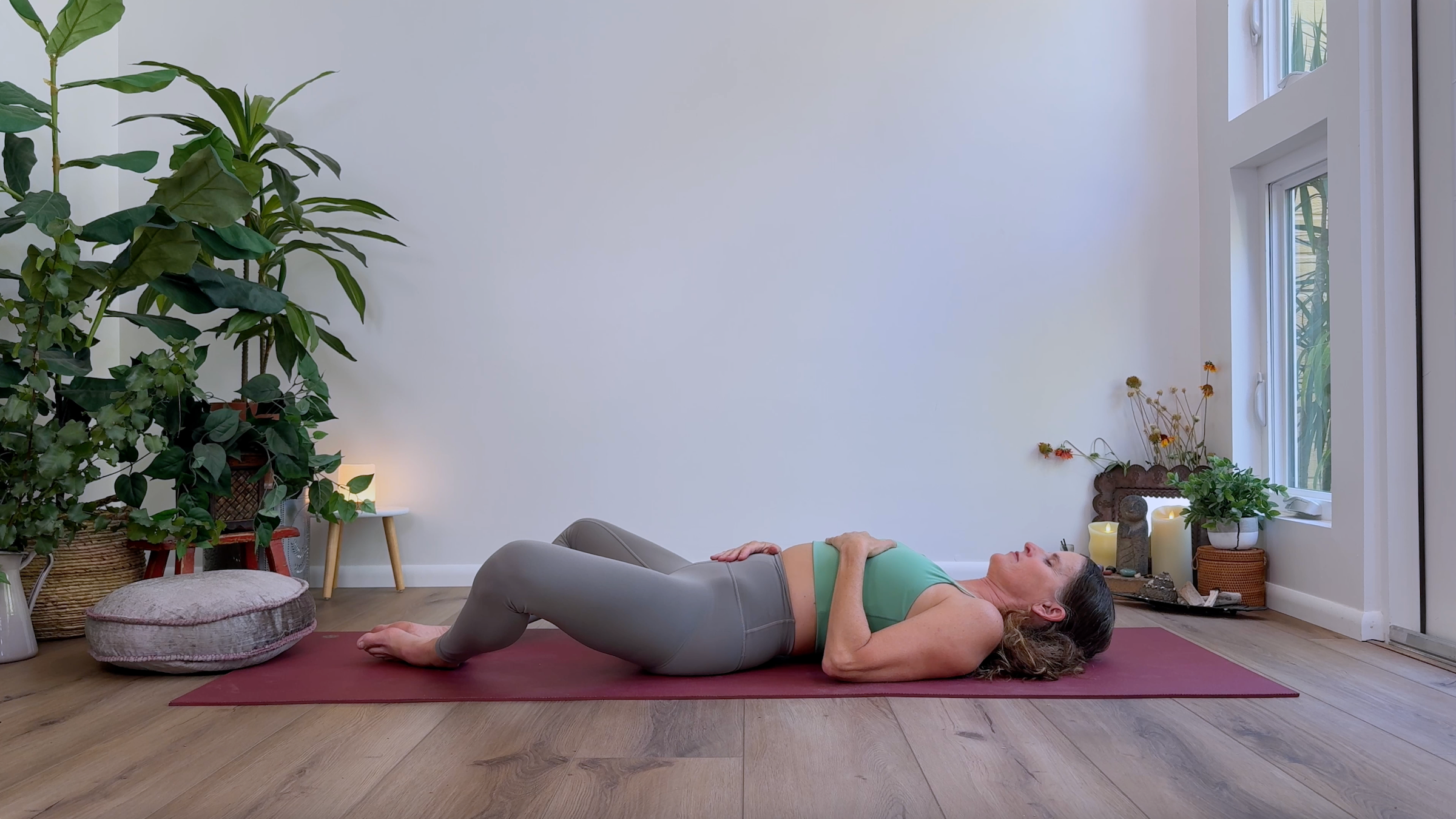 Yoga teacher Devi Daly in Reclined Butterfly, part of her yin yoga practice