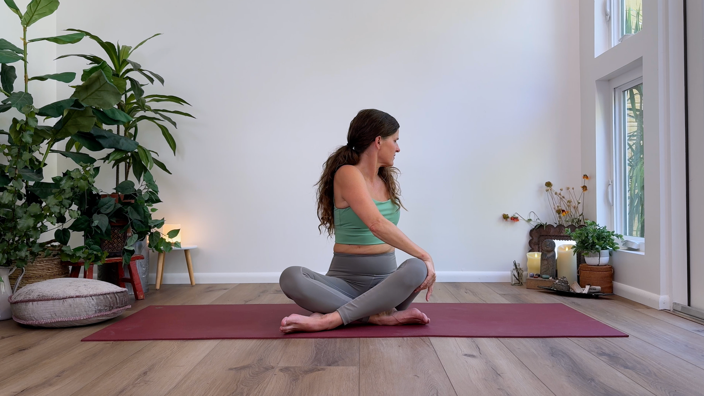 Yoga teacher Devi Daly in Seated Twist