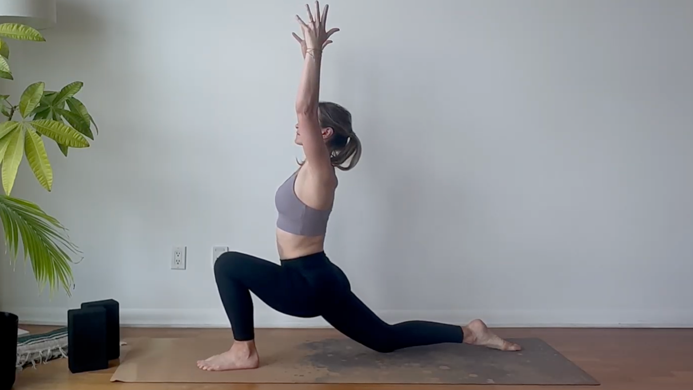 Yoga teacher Julia Eskins practicing yoga for mobility in Low Lunge